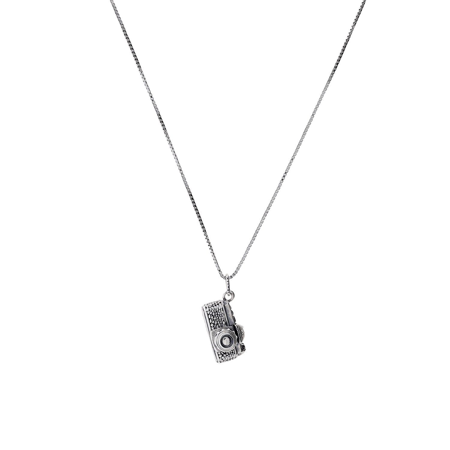 Sterling silver pendant shaped like a detailed vintage film camera, hanging from a fine, elegant chain for a sculptural and contemporary silver jewellery piece.
