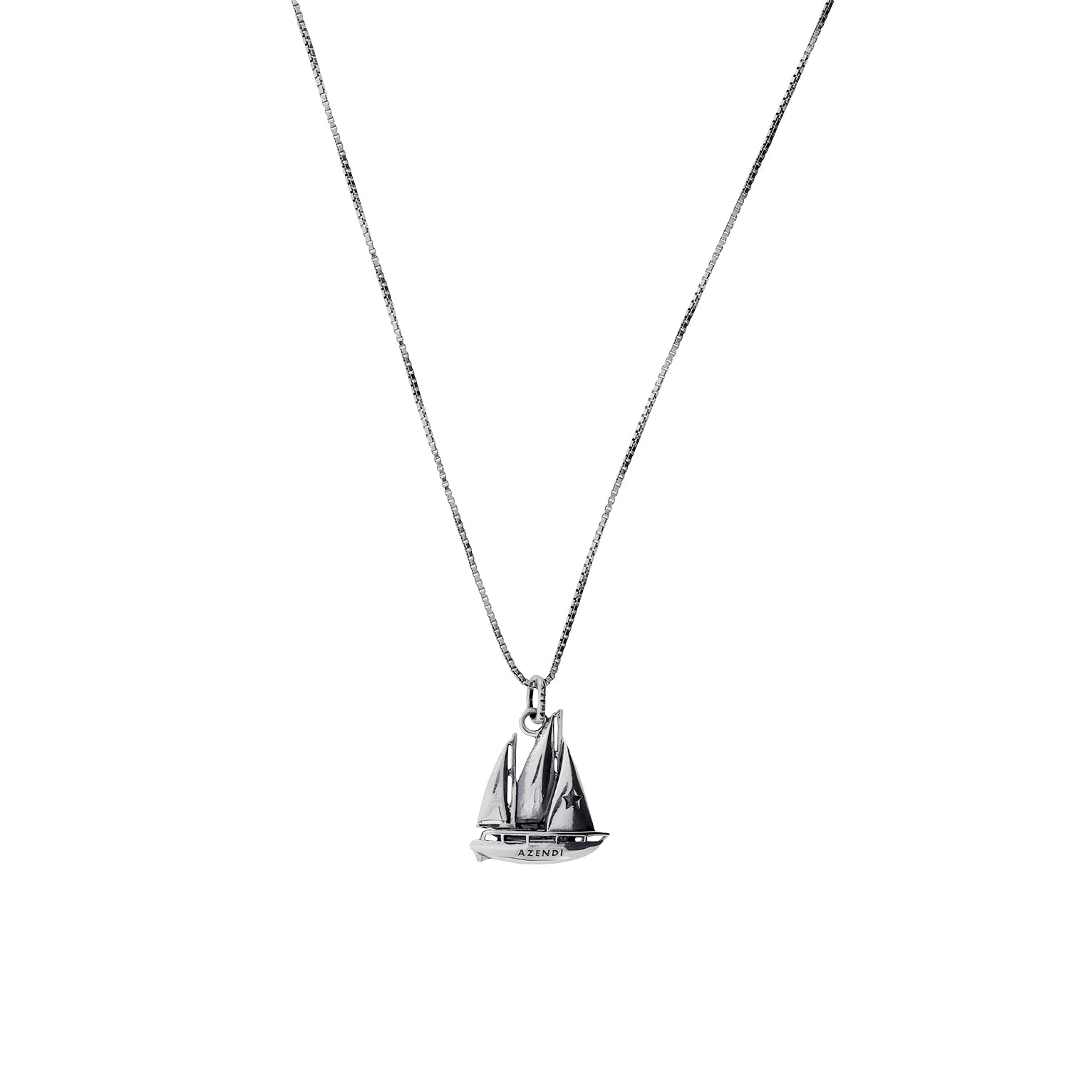 Sterling silver pendant shaped like a detailed sailing boat suspended from a fine chain, showcasing a refined nautical design from an award-winning British jeweller.