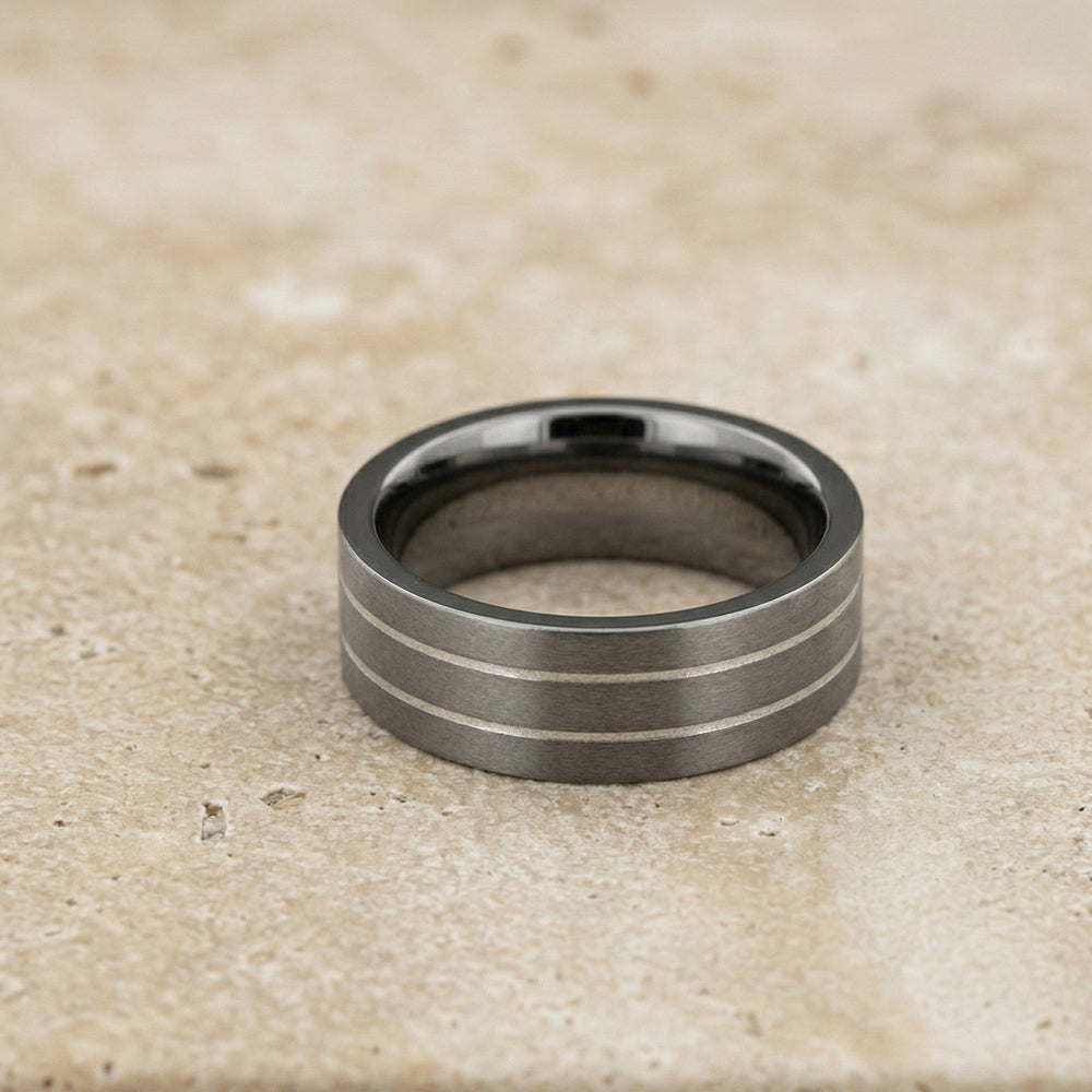 Contemporary band ring crafted from titanium featuring three slim polished silver stripes for a modern and sculptural look in men's silver jewellery.
