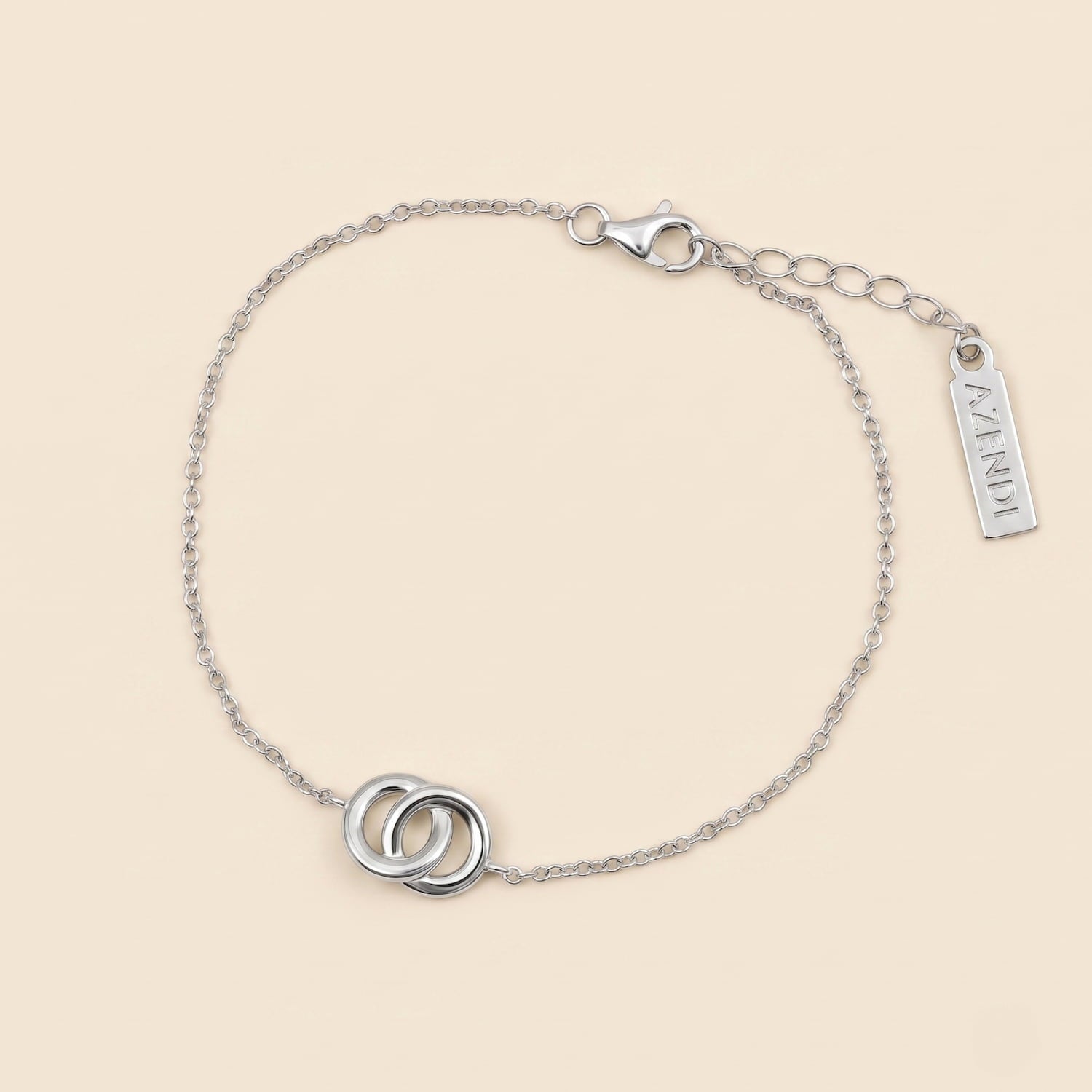 Delicate sterling silver bracelet featuring an interlocking circles motif with an adjustable extension chain, exemplifying elegant and modern Azendi silver jewellery design.