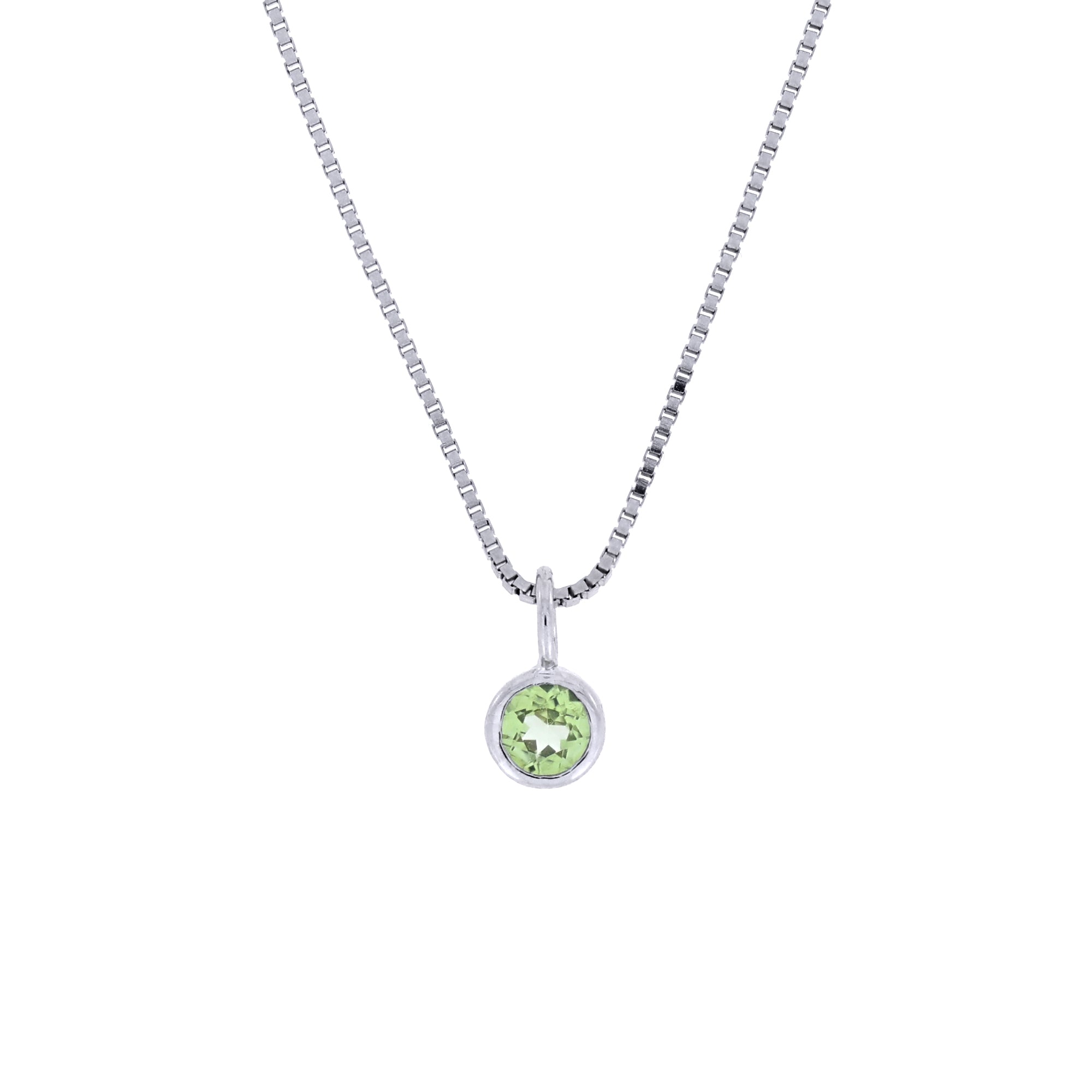 Elegant sterling silver pendant featuring a single round peridot gemstone in a minimalist bezel setting, suspended from a sleek fine chain for a timeless look.