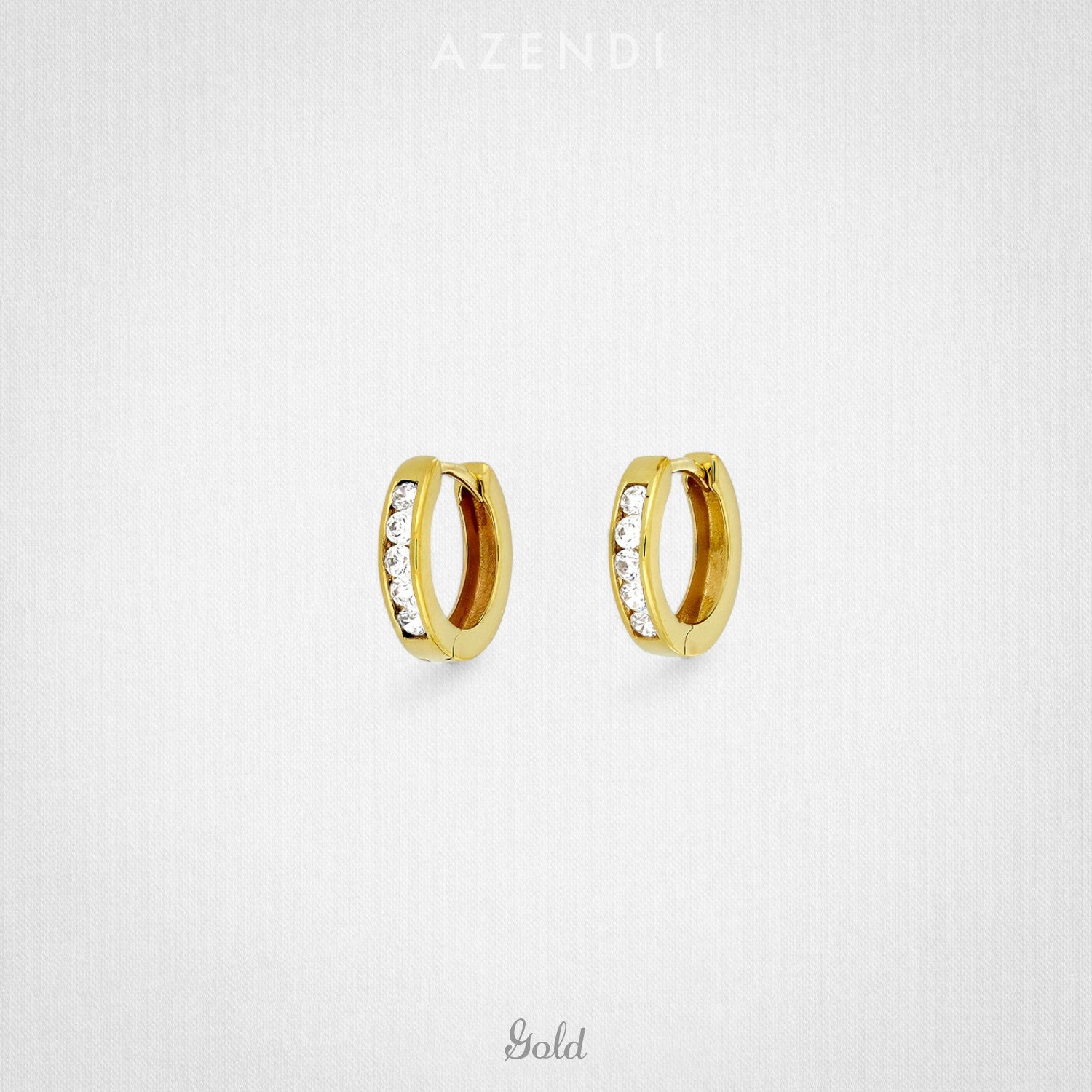 Pair of 9 carat gold hinged hoop earrings featuring a row of small sparkling stones, combining elegant design with refined detailing in gold vermeil jewellery by Azendi.