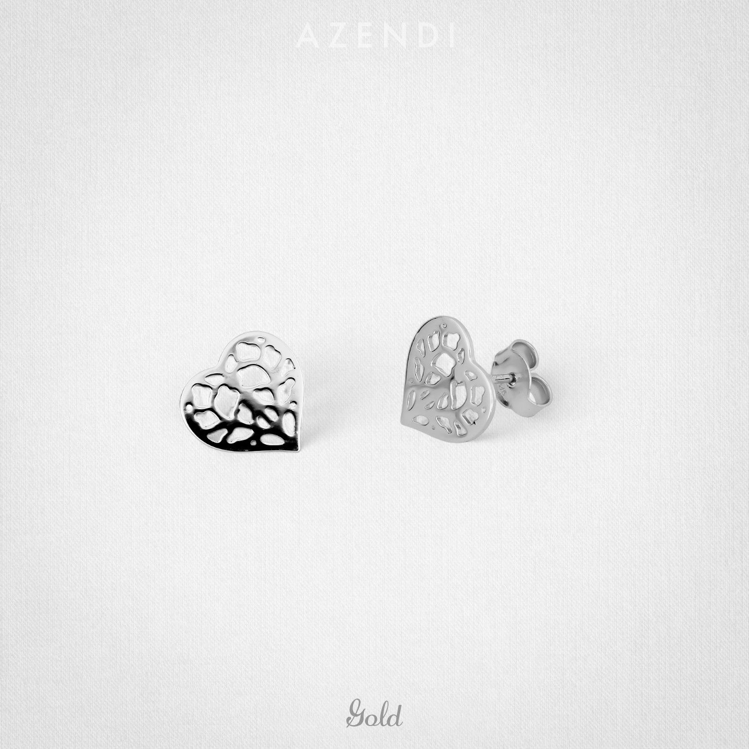 Pair of 9 carat white gold stud earrings featuring openwork heart shapes inspired by Yorkshire, showcasing a delicate and sculptural design for refined contemporary jewellery.
