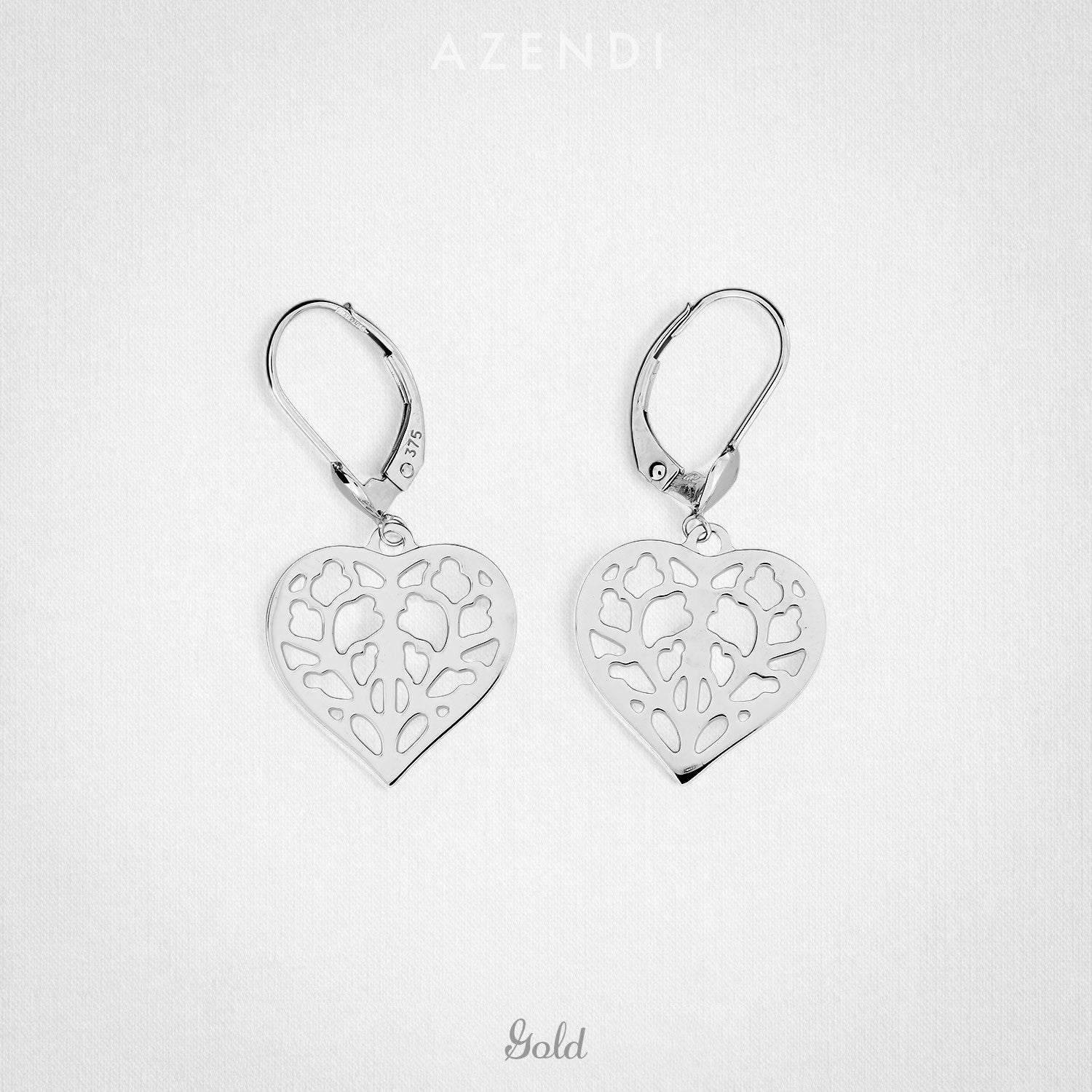 Pair of 9 carat white gold drop earrings featuring openwork heart-shaped designs inspired by Yorkshire, combining delicate floral motifs with a polished contemporary finish.