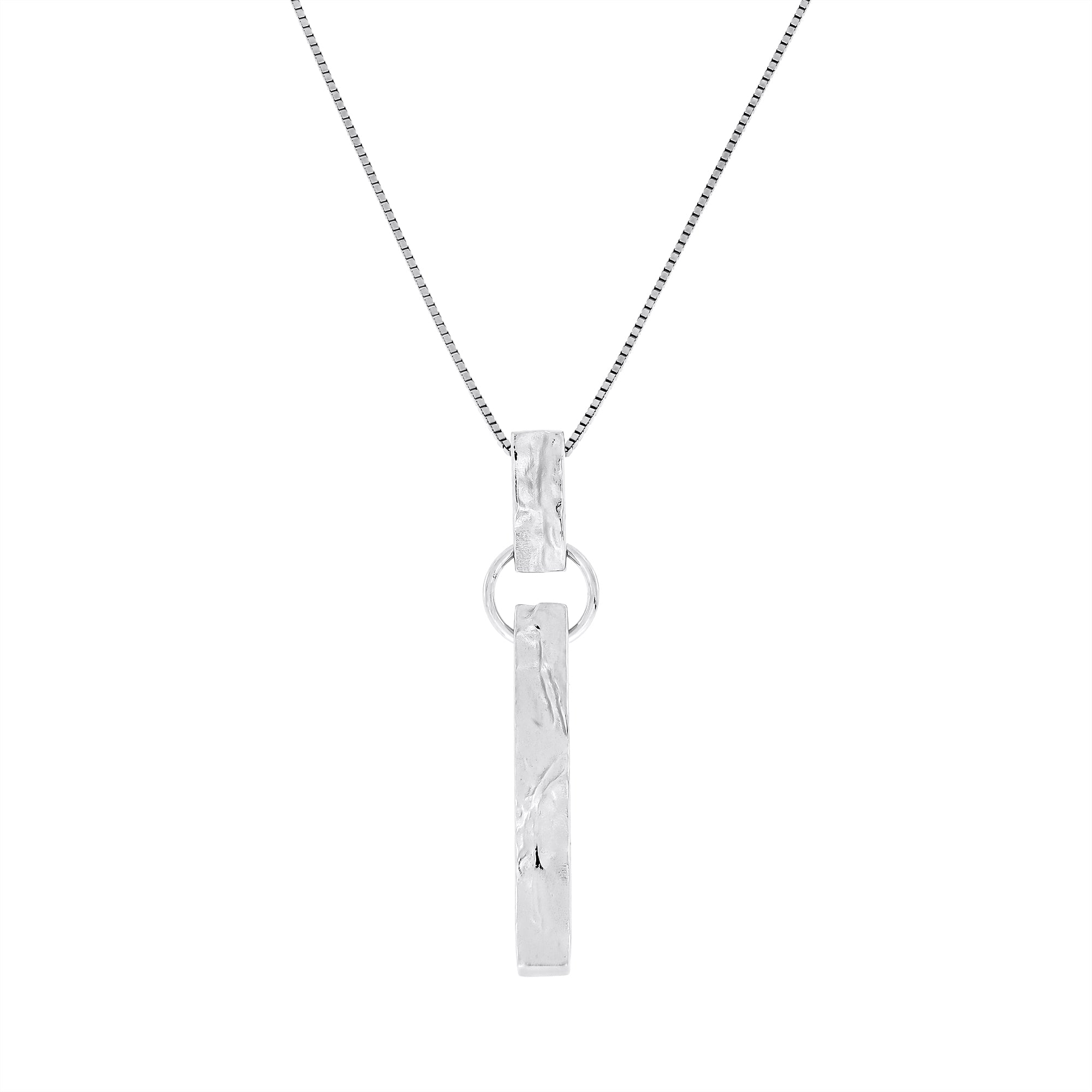 Contemporary sterling silver pendant featuring a textured vertical bar suspended from a simple circular link on a fine chain, reflecting modern British jewellery design.