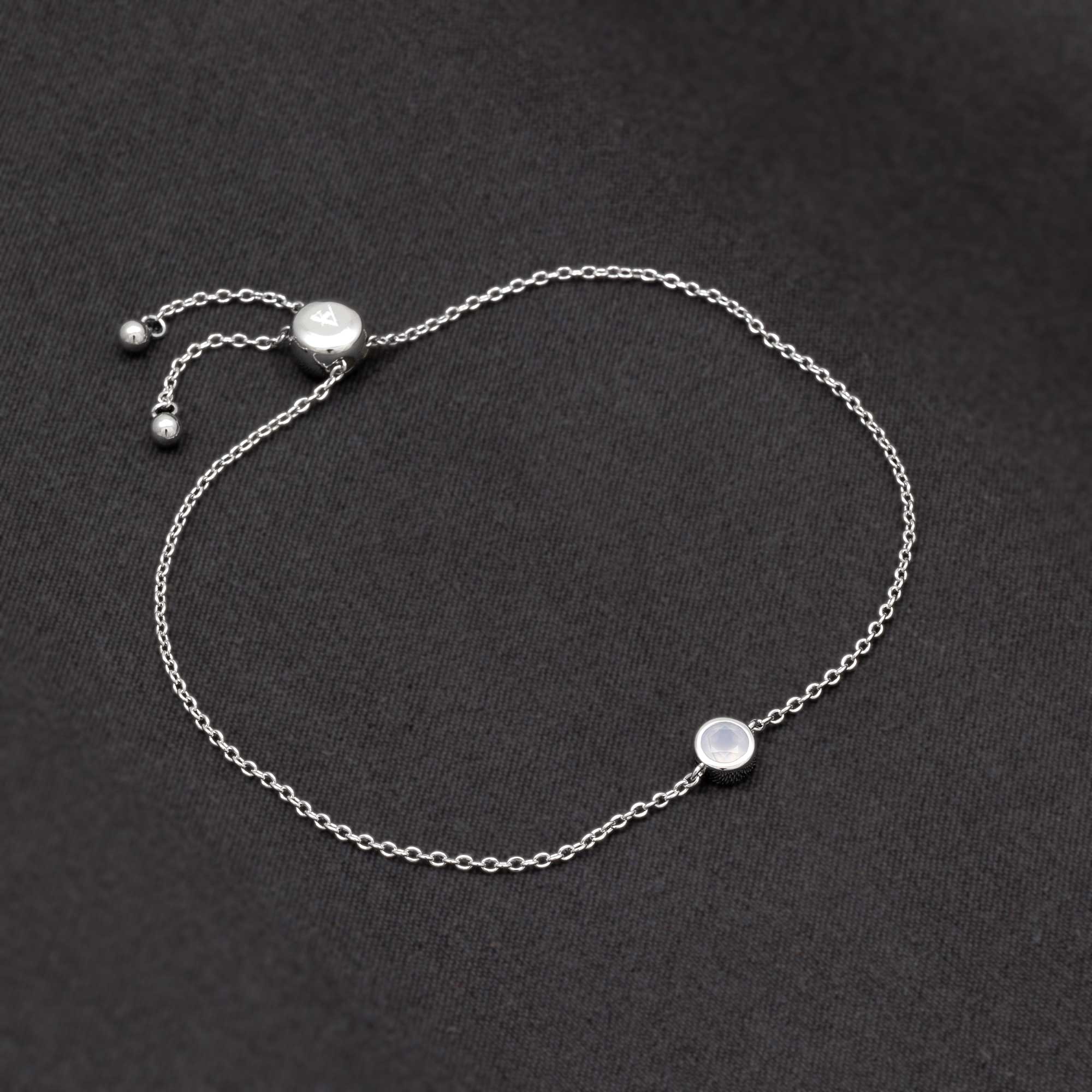 Adjustable sterling silver bracelet featuring a delicate aqua chalcedony birthstone, designed with a sliding clasp for a refined and contemporary look.