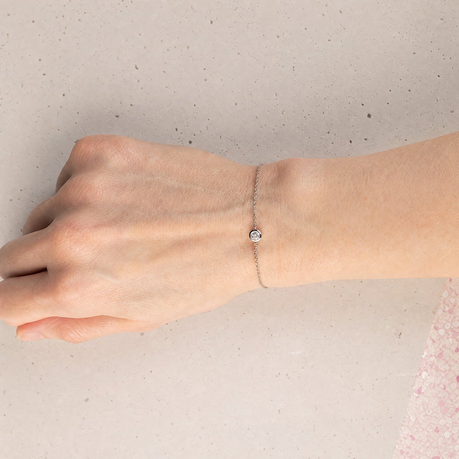 Delicate sterling silver bracelet featuring a polished white topaz gemstone with an adjustable sliding chain, embodying refined British craftsmanship by Azendi.