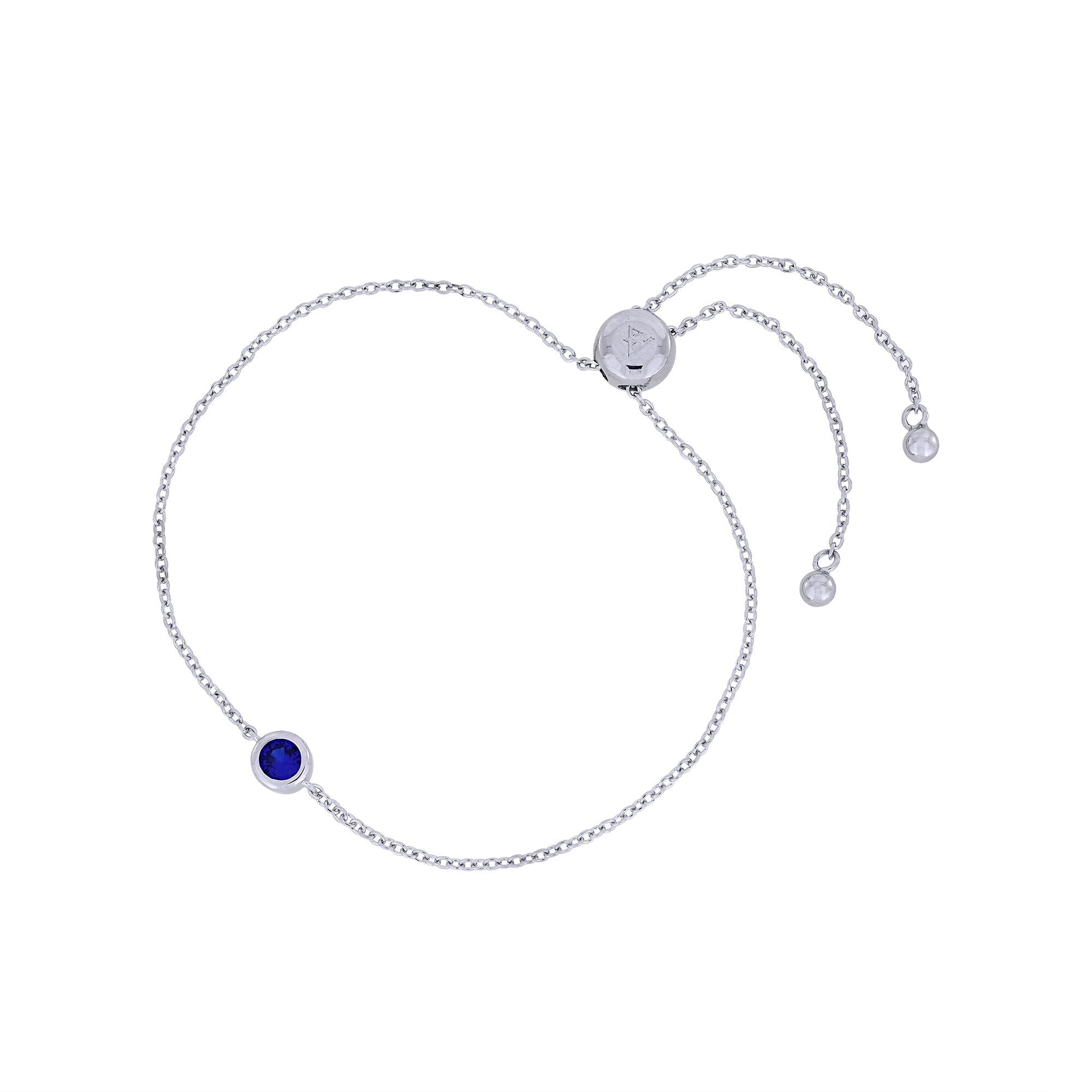 Adjustable sterling silver bracelet featuring a deep blue spinel gemstone, combining minimalist elegance with expert British craftsmanship for a timeless accessory.