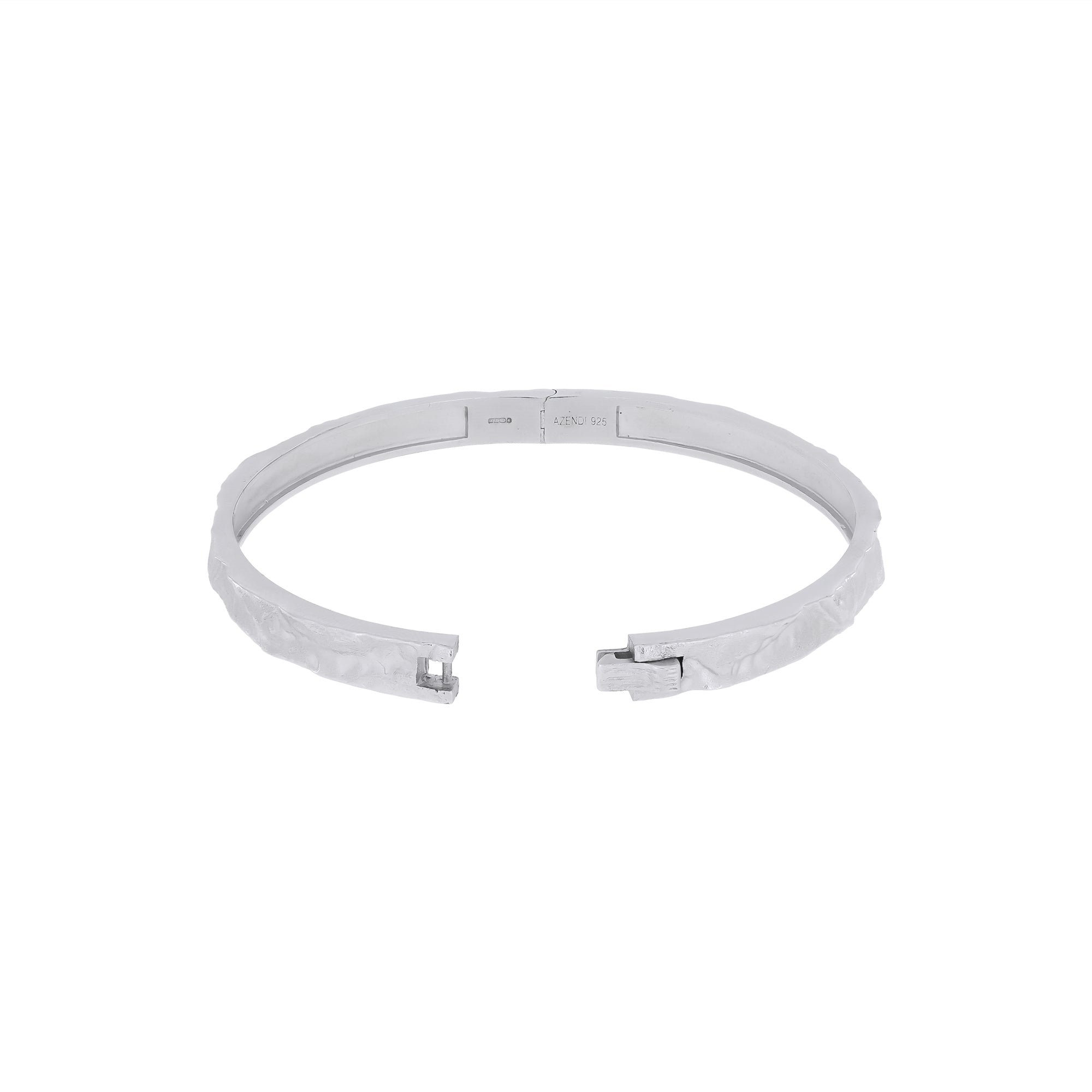 Sterling silver bangle featuring a sculpted textured band with a polished interior and secure clasp, showcasing contemporary British silver jewellery craftsmanship by Azendi.