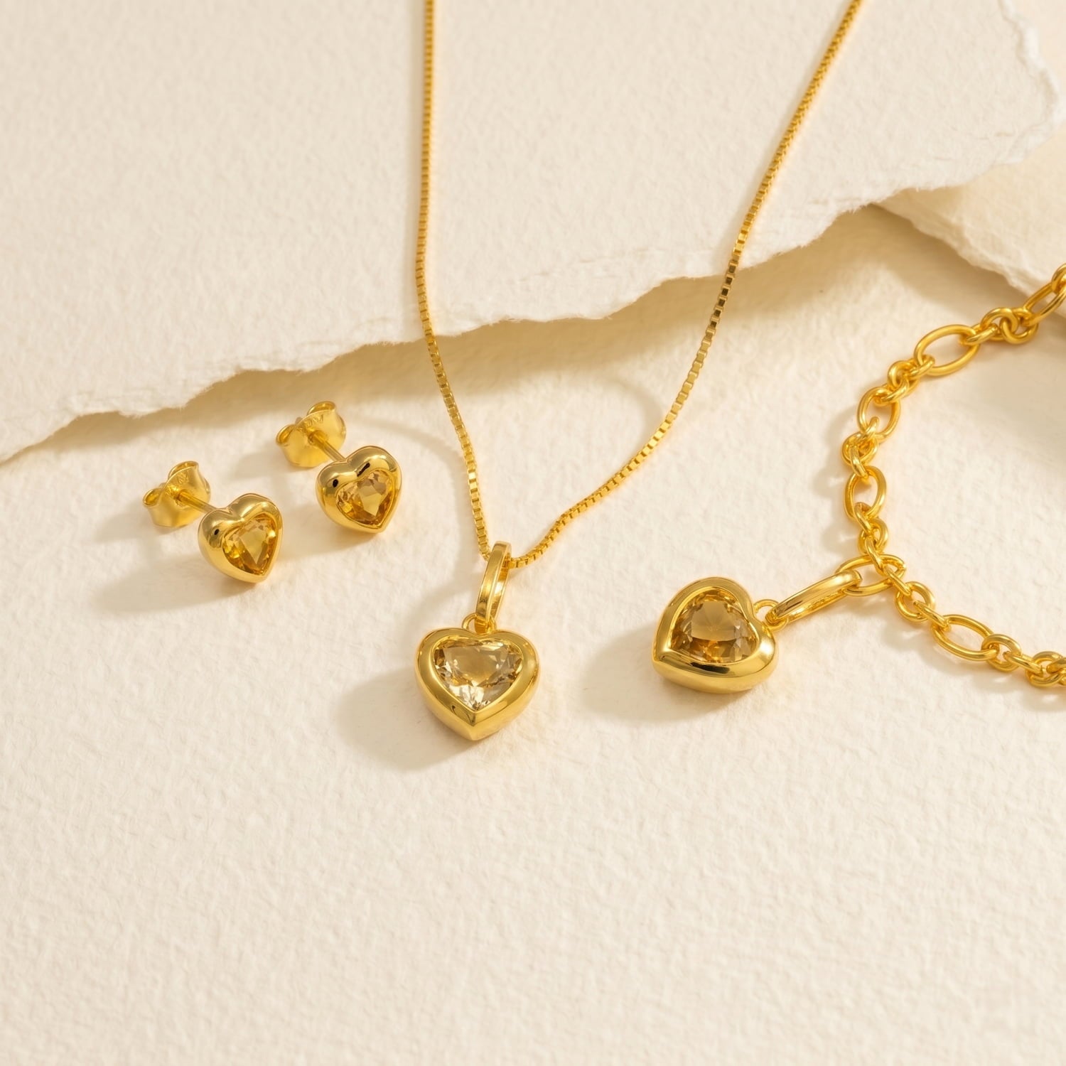 Gold vermeil heart-shaped citrene jewellery set including necklace, earrings, and bracelet