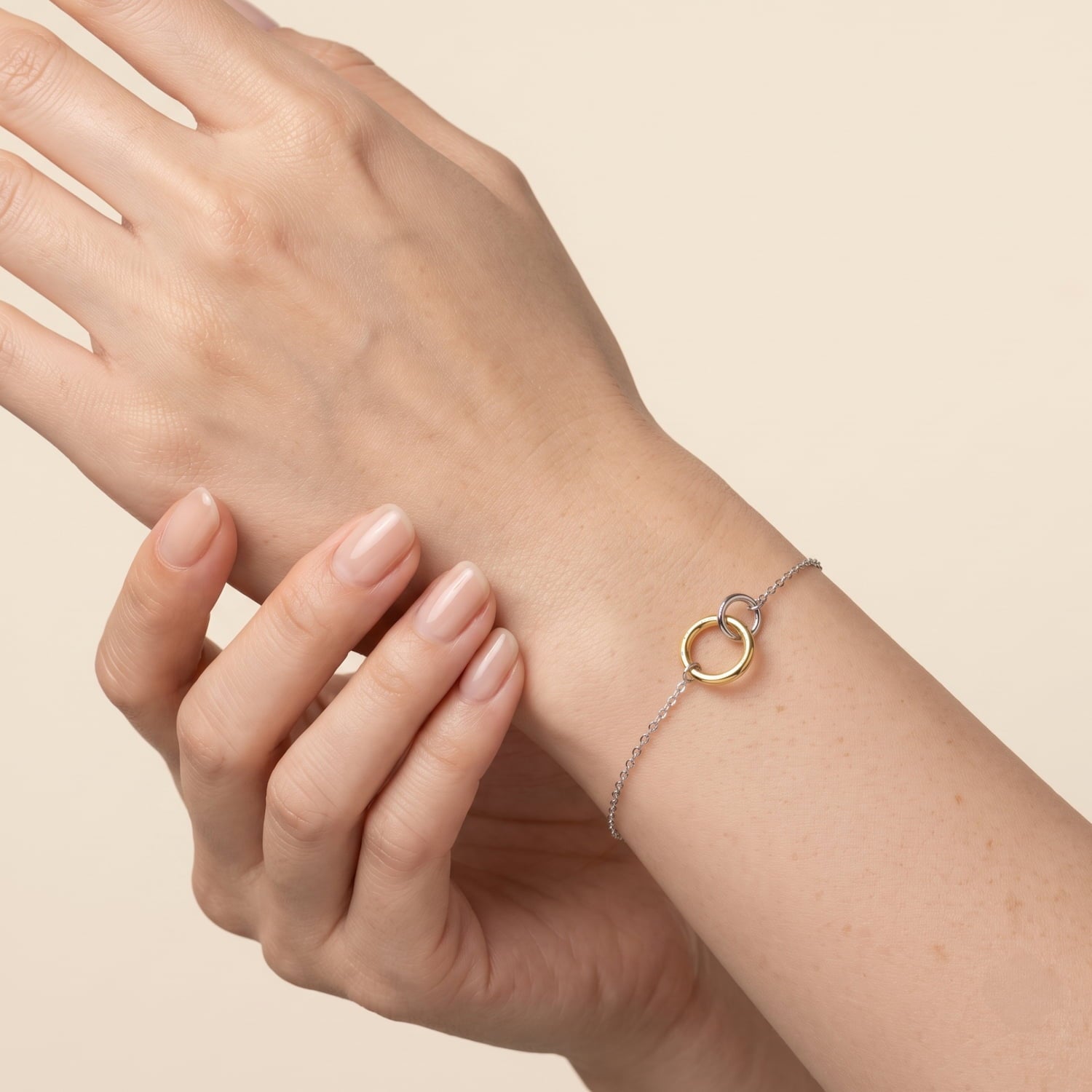 Silver and gold vermeil interlocking circles bracelet modelled on a wrist