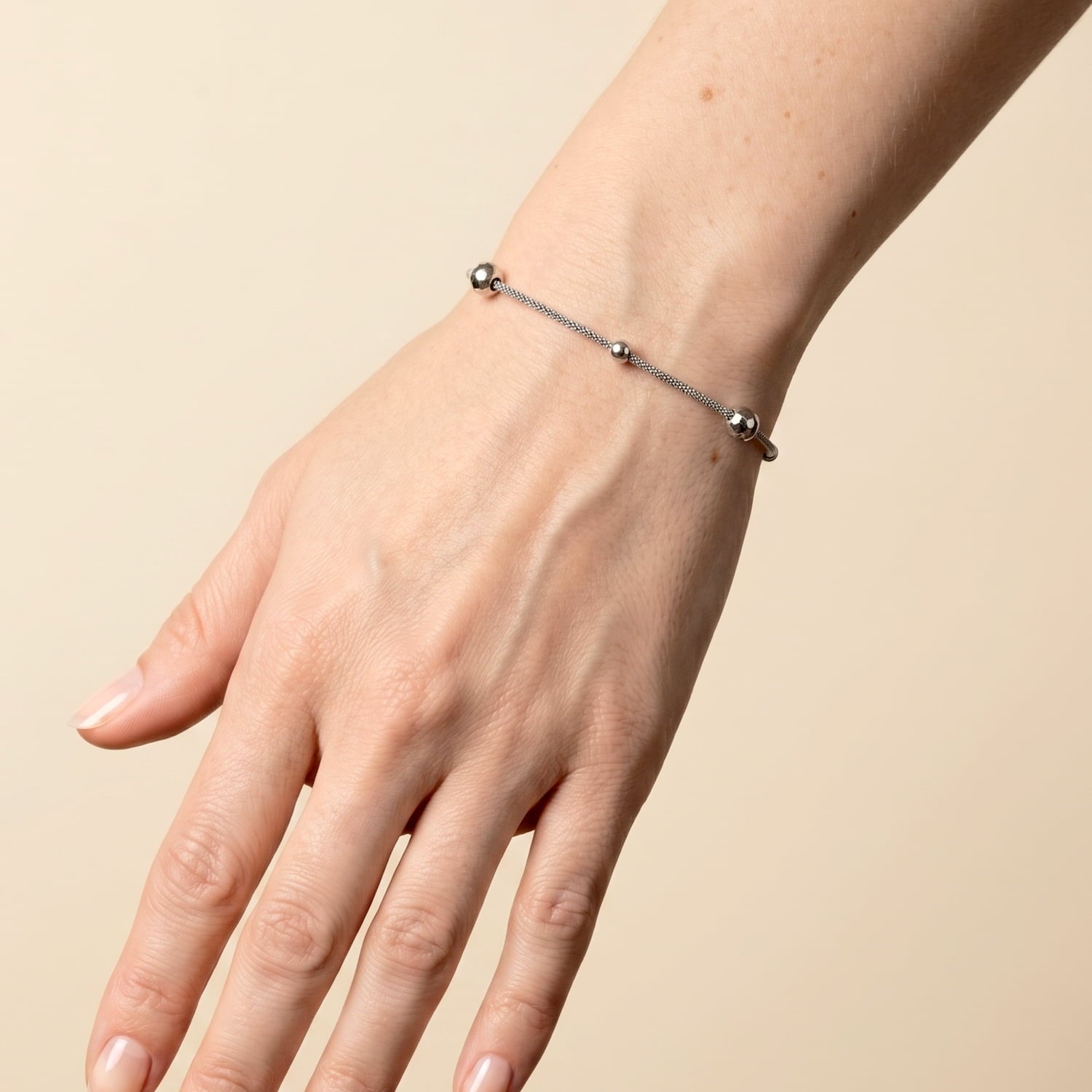 Sterling silver popcorn chain bracelet with textured beads worn on the wrist.