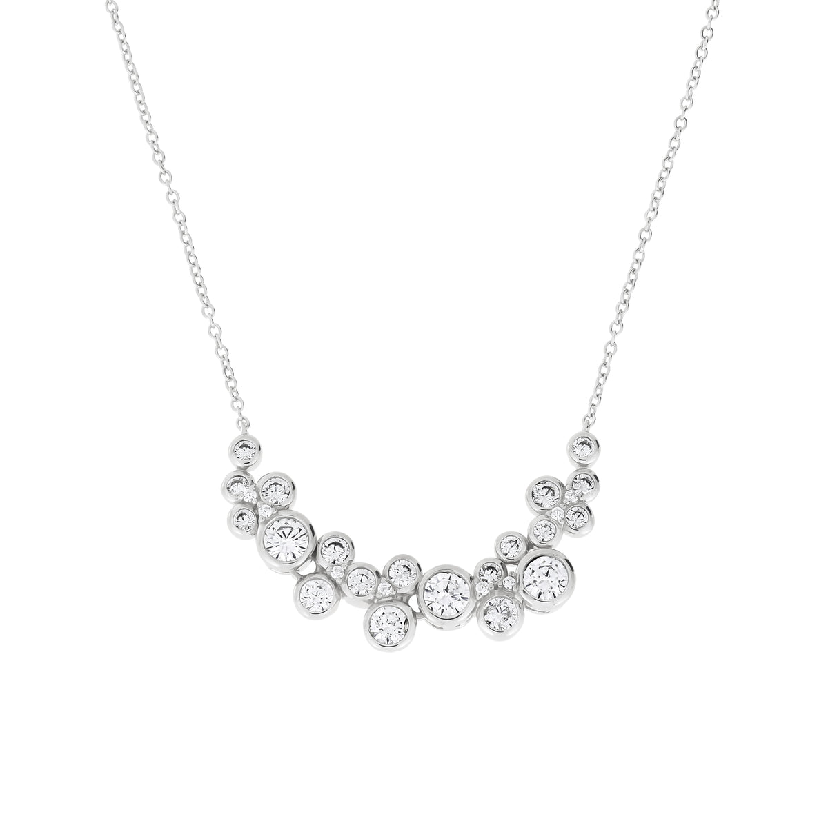 A silver necklace featuring a curved cluster of clear round-cut cubic zirconia stones on a delicate chain, presented on a solid white background.