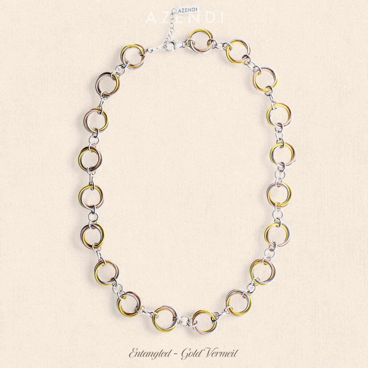 Sterling silver necklace featuring an elegant arrangement of interconnected gold vermeil and silver circular links, offering a sculptural and contemporary design.