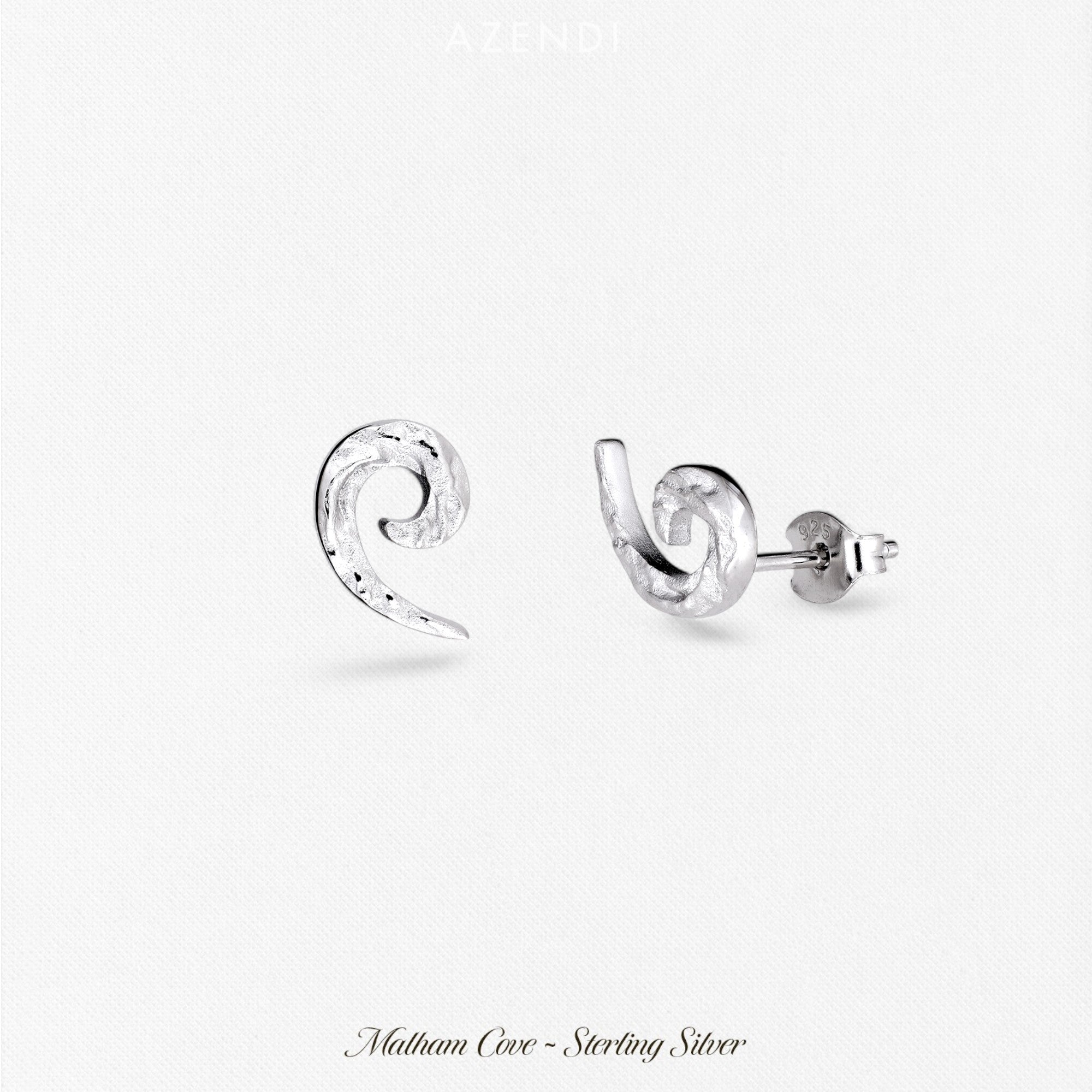 Pair of sterling silver curling horn stud earrings with a textured finish, showcasing a sculptural and contemporary design in refined British silver jewellery.