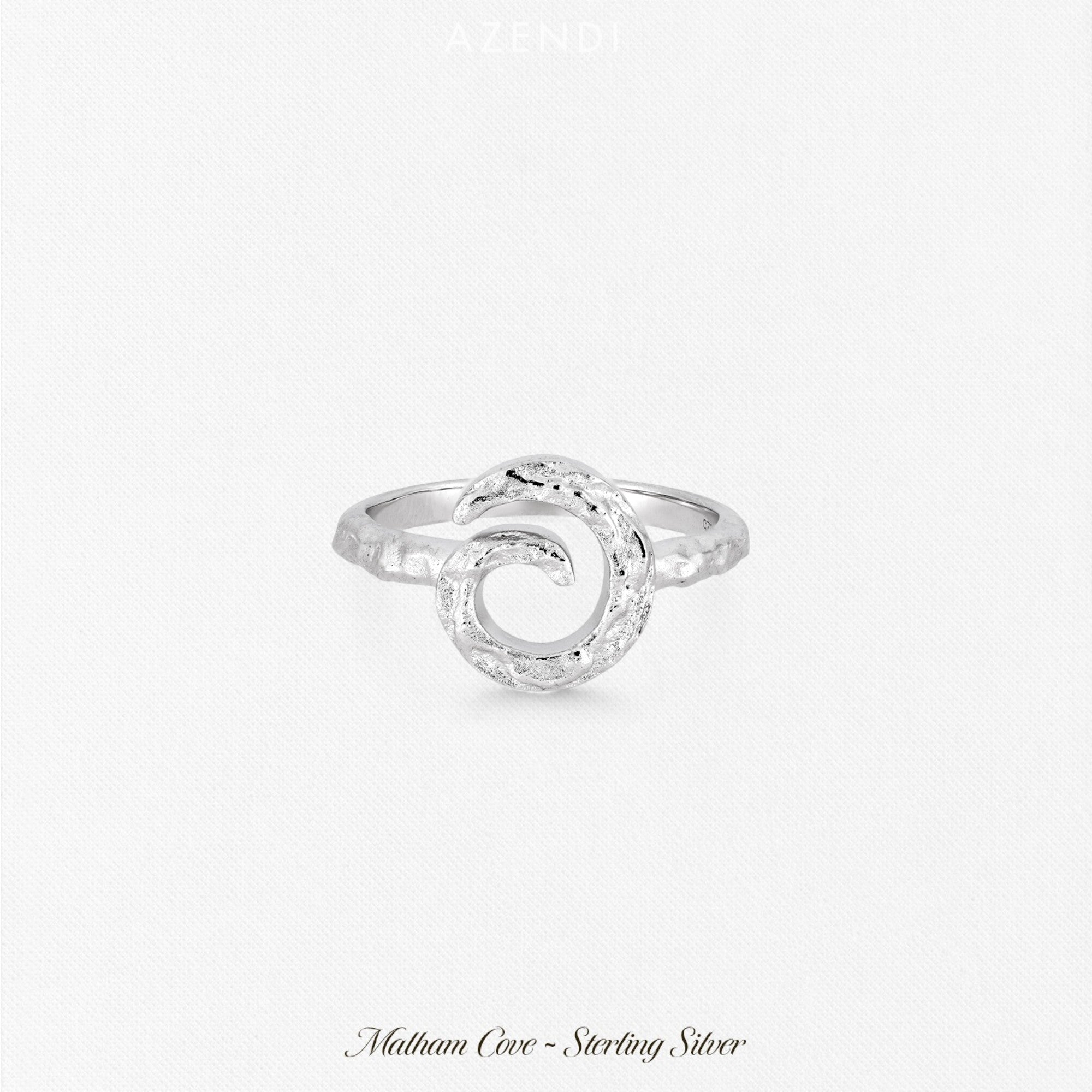 Sterling silver ring featuring a textured curling horn design with a sculptural, organic form, exemplifying refined contemporary silver jewellery craftsmanship.