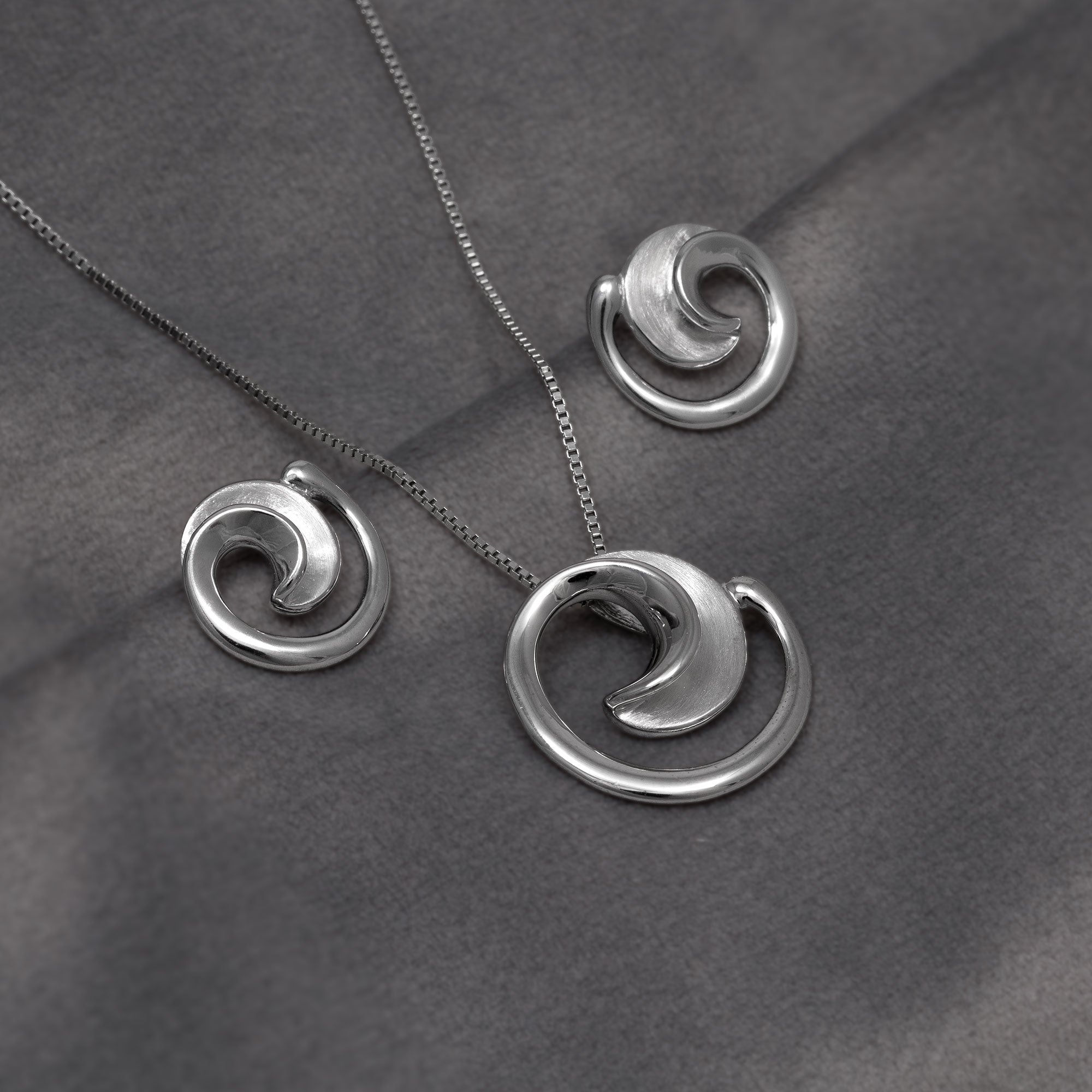 Silver Satin and Polished Curling Stud Earrings