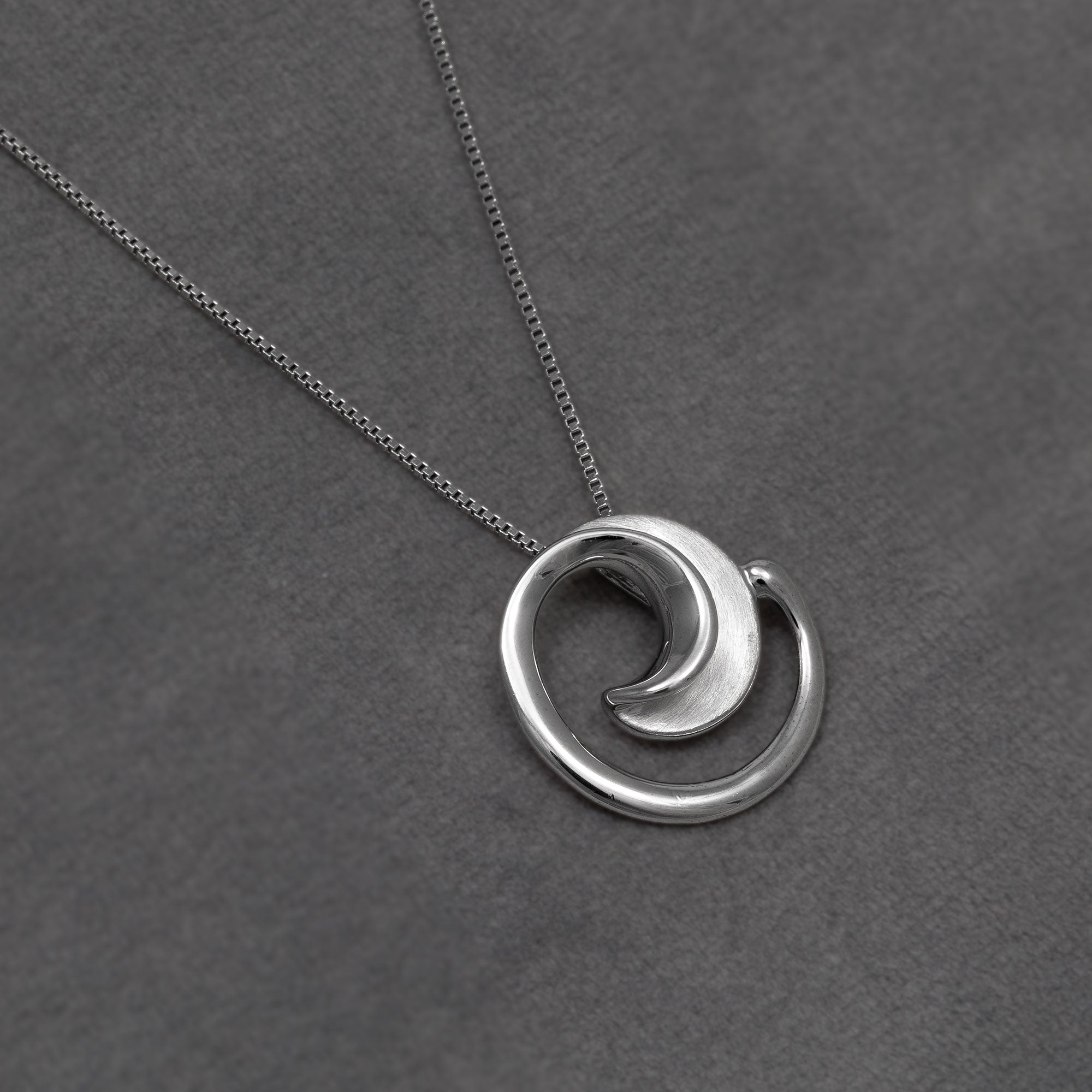 Silver Satin and Polished Curling Pendant