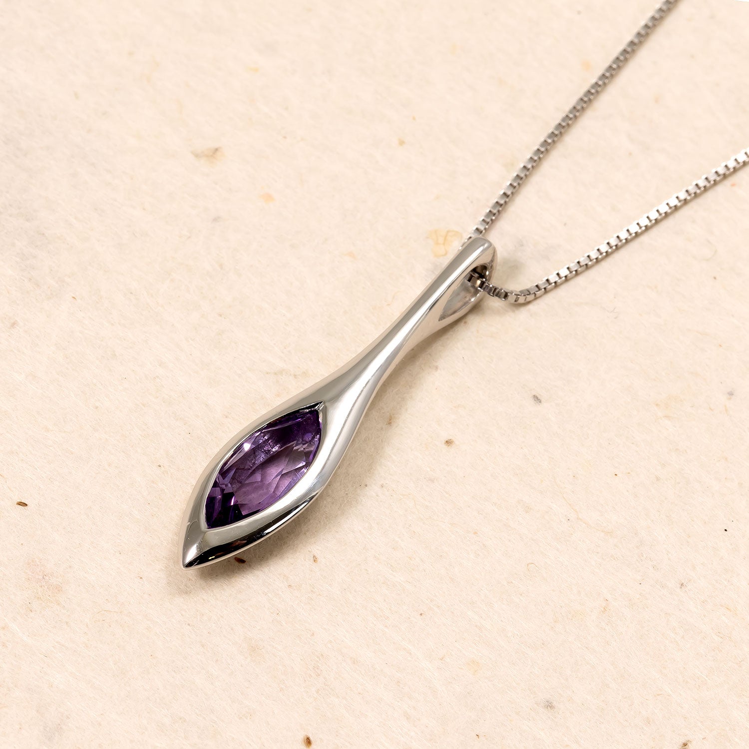 Sleek sterling silver pendant featuring an elegant marquise-cut amethyst gemstone, suspended on a fine box chain for a refined and contemporary silver jewellery look.