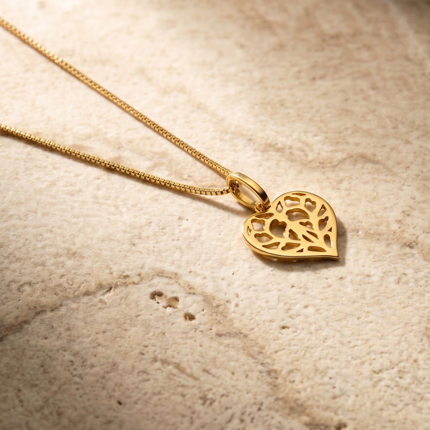 Gold vermeil necklace featuring a delicate miniature heart pendant inspired by Yorkshire, with an intricate filigree design on a fine chain.