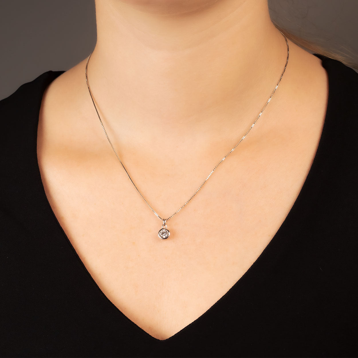 Medium Brilliant Cut Cubic Zirconia Pendant with a Rub-over Setting