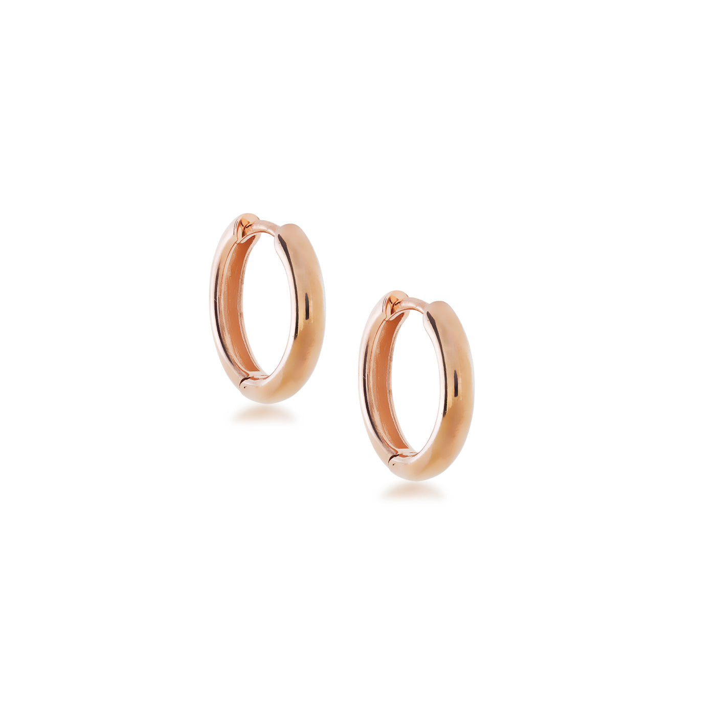 Polished medium-sized rose gold vermeil hoop earrings with a rounded profile, featuring a secure hinged closure for modern sterling silver jewellery elegance.