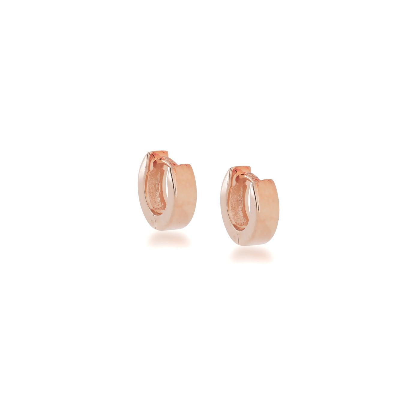 Pair of small squared hoop earrings in polished rose gold vermeil, featuring smooth surfaces and a hinged design for comfortable wear in contemporary fine jewellery.