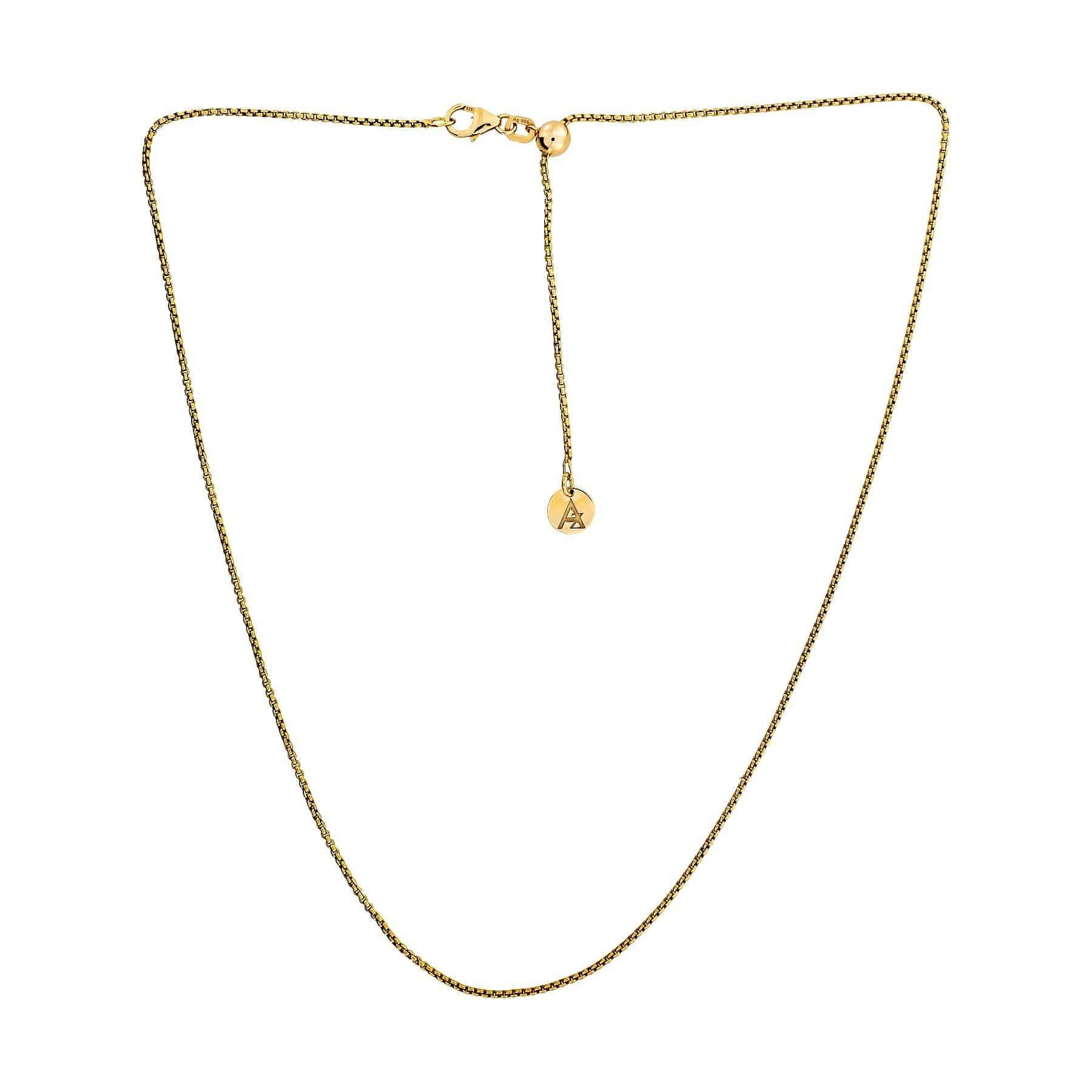 Delicate gold vermeil rollo chain necklace featuring a sliding adjuster and small round charm with engraved detail, displayed on a white background.