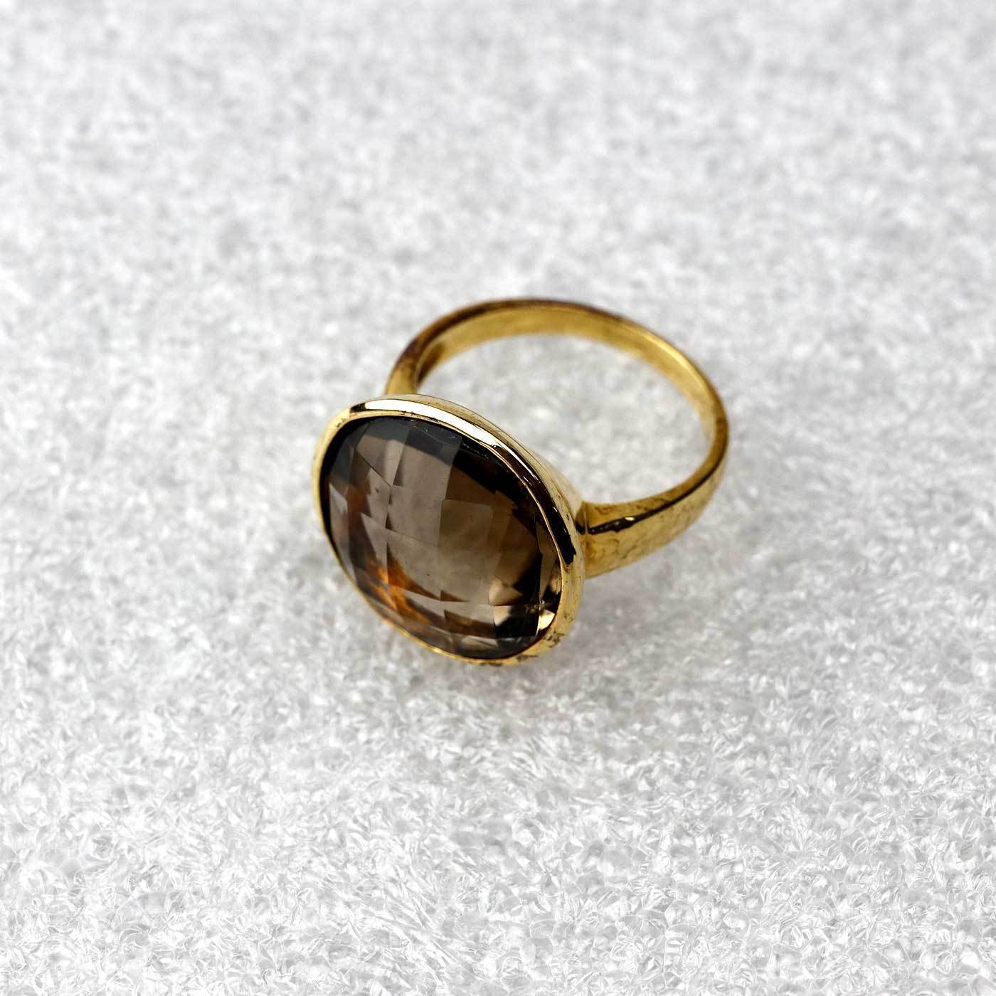 Gold vermeil ring featuring a large faceted smoky quartz gemstone with a polished band, showcasing a sculptural and refined design from Azendi’s sterling silver jewellery collection.