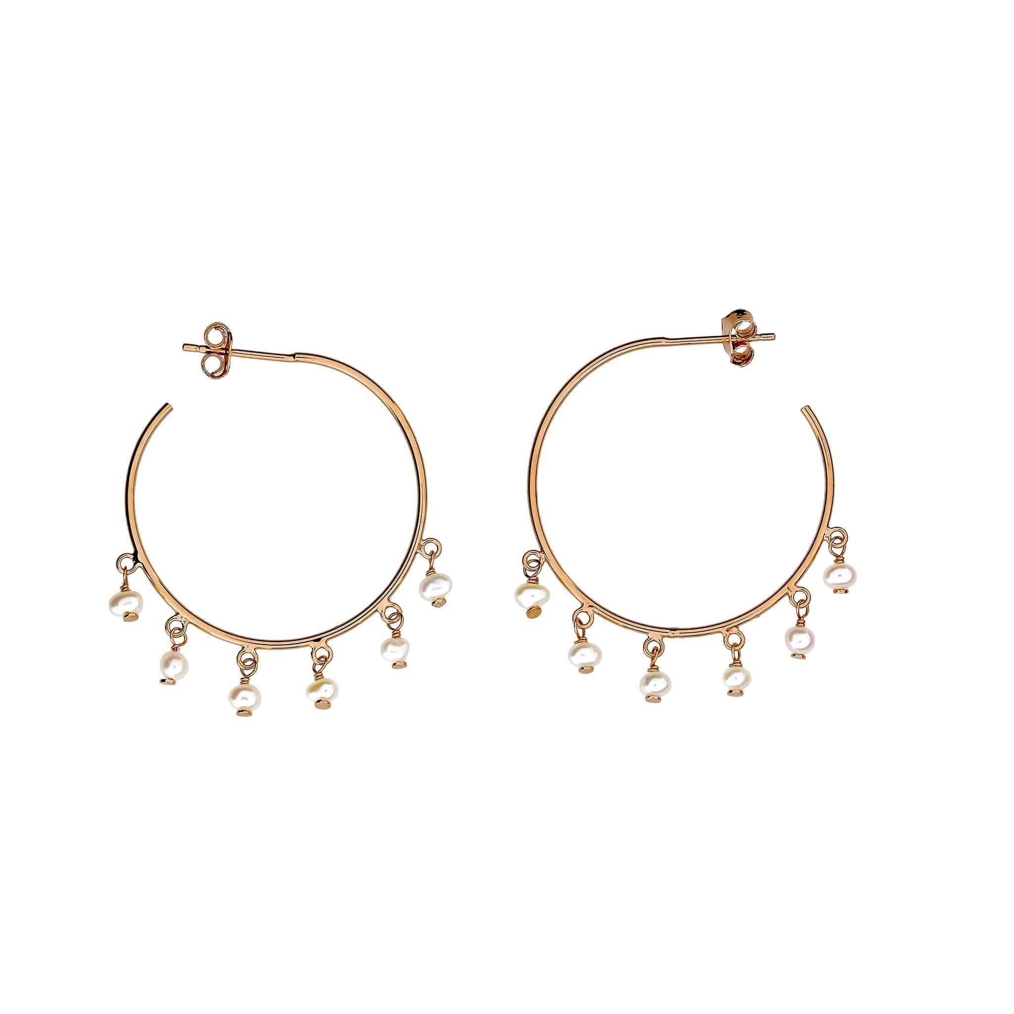 Pair of gold vermeil hoop earrings featuring multiple small dangling pearls, creating a refined and contemporary silhouette in sterling silver jewellery design.