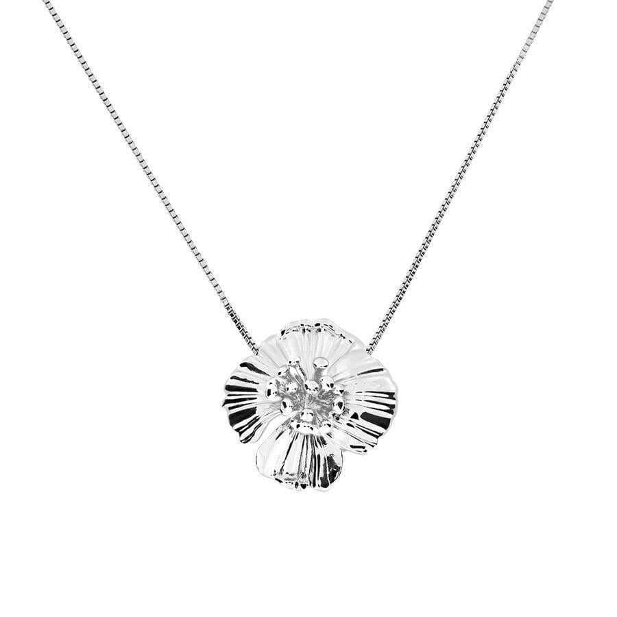 Sterling silver pendant shaped as a detailed poppy flower with polished surfaces, suspended on a fine chain, combining sculptural artistry with contemporary British design.