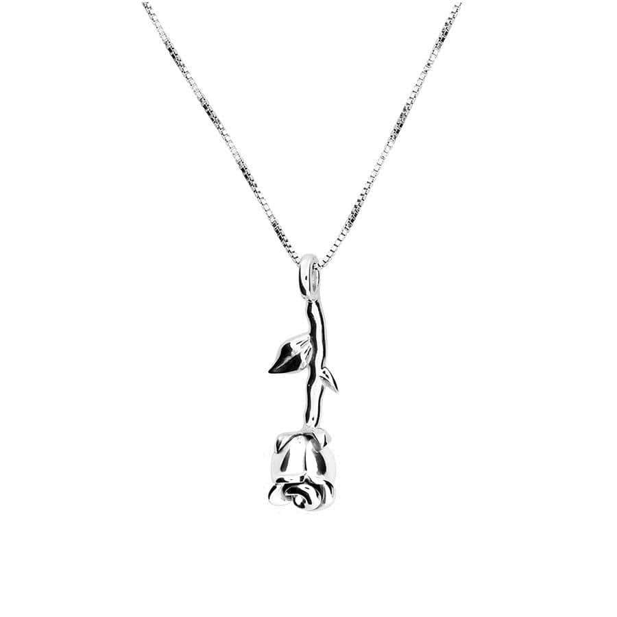 Delicate sterling silver pendant shaped as a sculptural rose with a slender stem and leaves, suspended from a fine chain for refined everyday elegance.