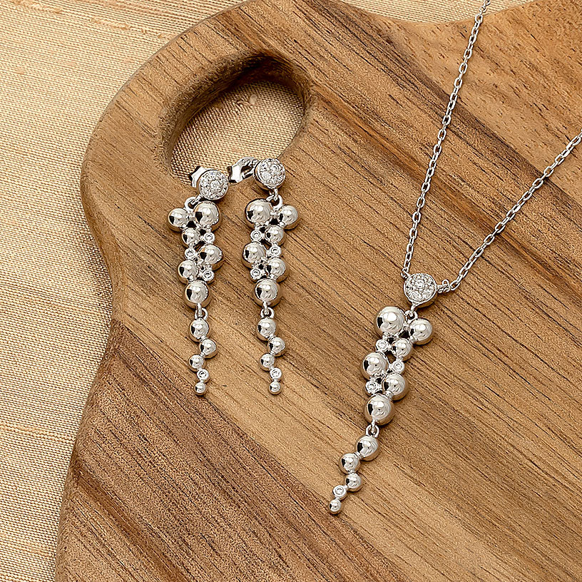 Aysgarth Falls sterling silver  jewellery set displayed on a wooden board