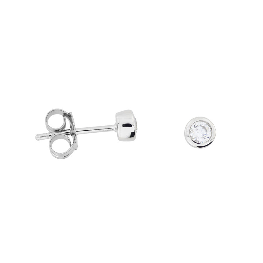 Pair of sterling silver stud earrings featuring brilliant cut clear stones set in a polished bezel, showcasing a refined and timeless design.
