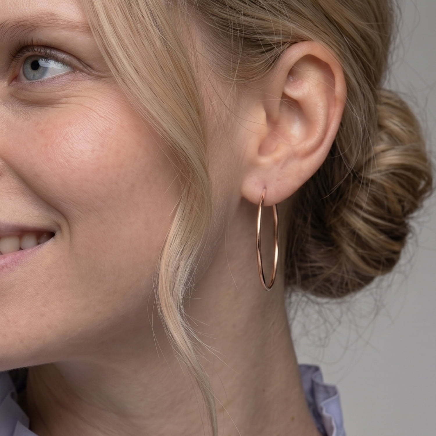 Sleek rose gold vermeil hoop earrings measuring 4cm in diameter with a smooth polished finish, showcasing a timeless, minimalist design in fine British silver jewellery.
