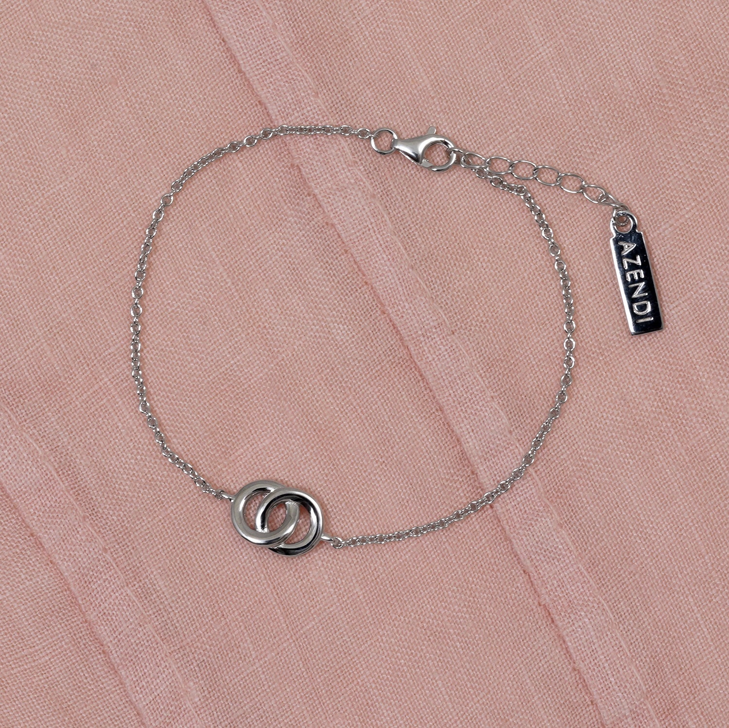 Delicate sterling silver bracelet featuring an interlocking circles motif with an adjustable extension chain, exemplifying elegant and modern Azendi silver jewellery design.