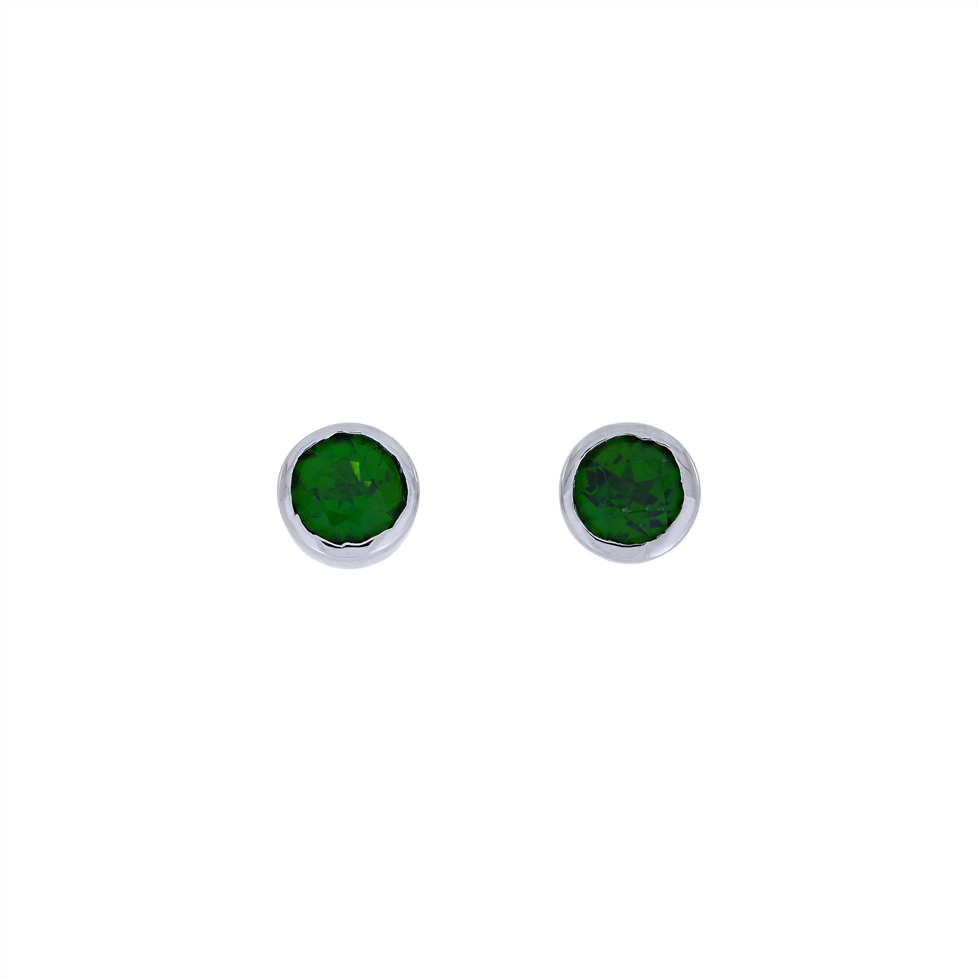 Round sterling silver stud earrings featuring vibrant Siberian emerald gemstones, showcasing a minimalist and refined design by an award-winning British jeweller.