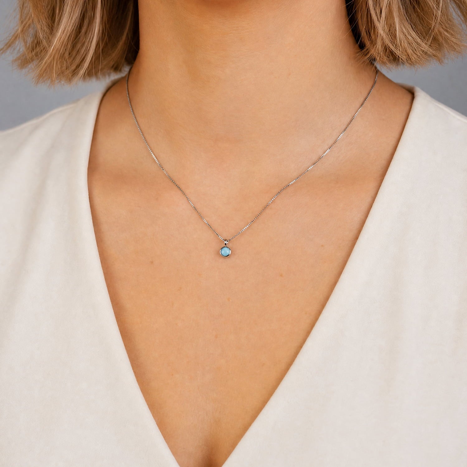 Sterling silver necklace featuring a vibrant turquoise gemstone pendant, showcasing a modern and elegant design by expert British craftsmanship.