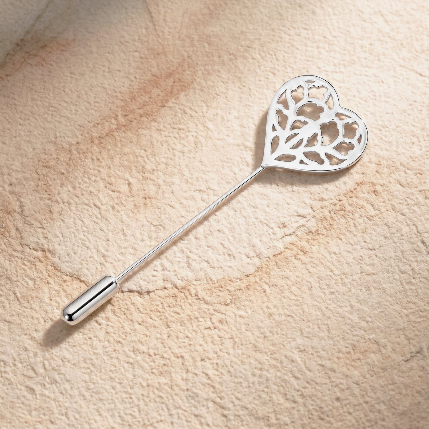 Sterling silver lapel pin featuring an intricately cut-out heart design inspired by Yorkshire, combining delicate craftsmanship with contemporary British jewellery style.