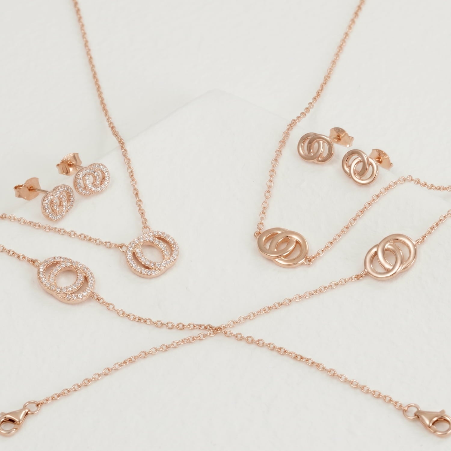 Two rose gold vermeil sets of necklace, bracelet and earrings