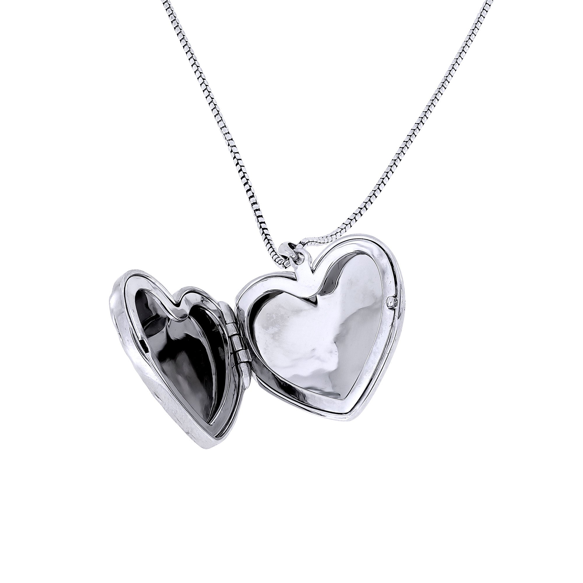 Sterling silver heart-shaped locket pendant with a smooth polished finish, suspended from a delicate chain, combining elegant craftsmanship with timeless design.