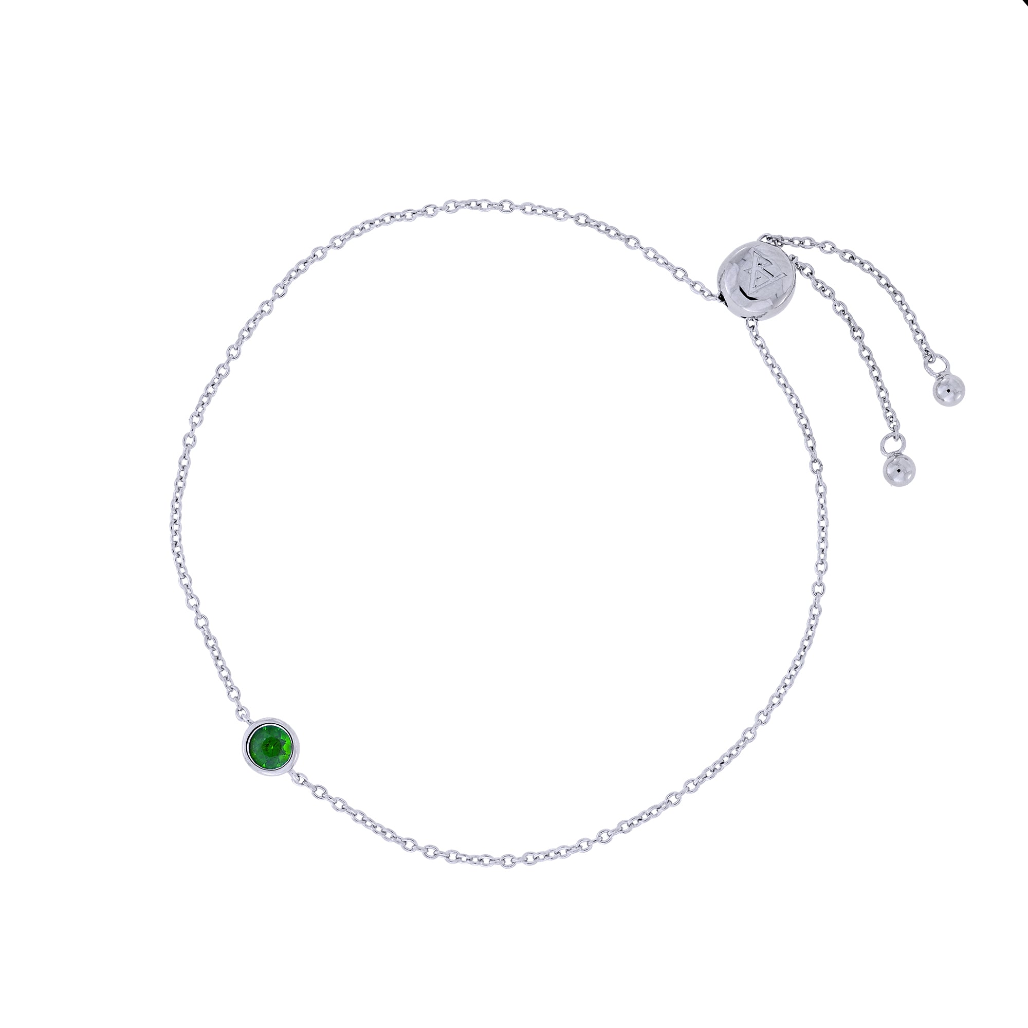 Delicate sterling silver adjustable bracelet featuring a single vibrant Siberian emerald gemstone, showcasing expert British craftsmanship with a sleek, minimal design.