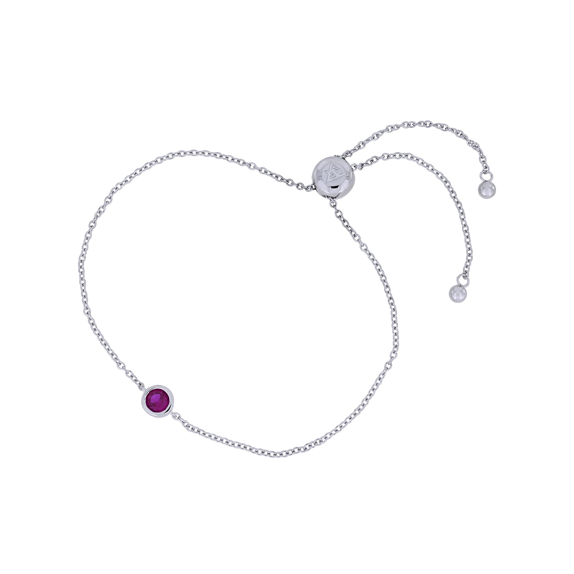 Adjustable sterling silver bracelet featuring a deep red ruby birthstone set in a sleek bezel, combining minimalist elegance with expert British craftsmanship.