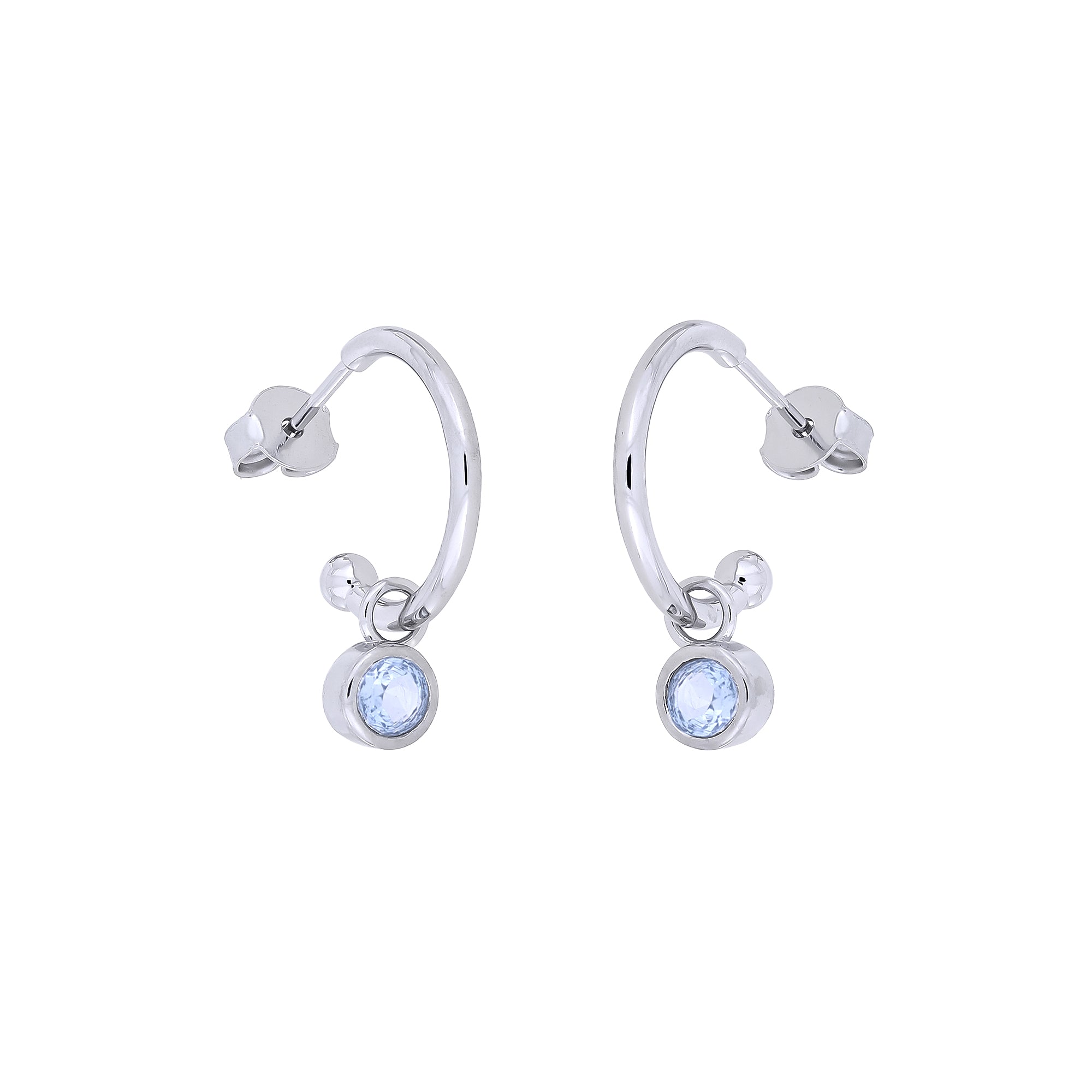 Delicate sterling silver hoop earrings featuring round blue topaz birthstone charms, showcasing a refined design with expert British craftsmanship from Azendi.