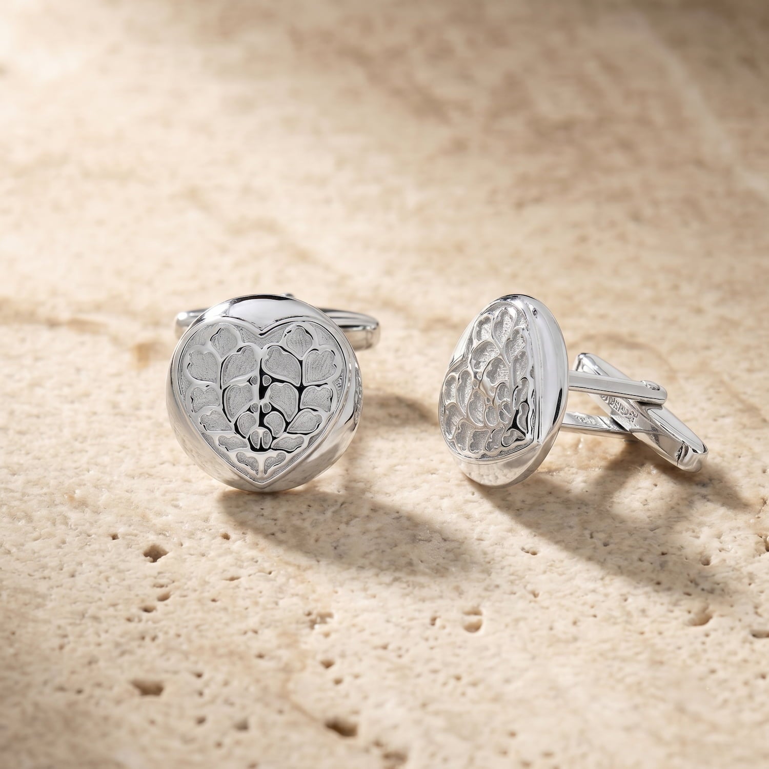 Pair of round sterling silver cufflinks featuring an intricate Heart of Yorkshire design, combining contemporary craftsmanship with subtle sculptural detailing.