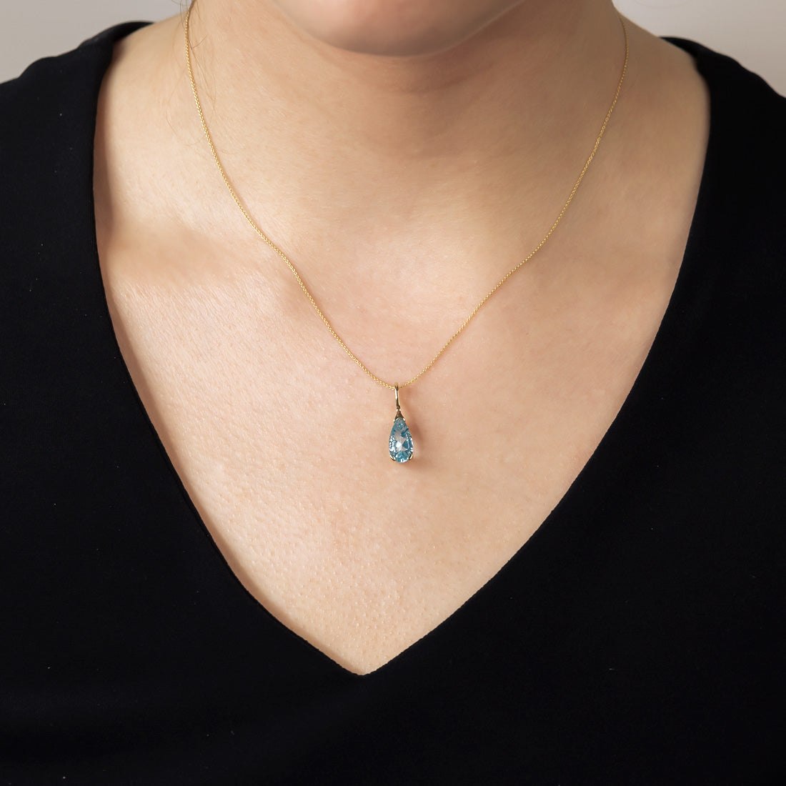 9 Carat Gold Blue Topaz Teardrop Pendant