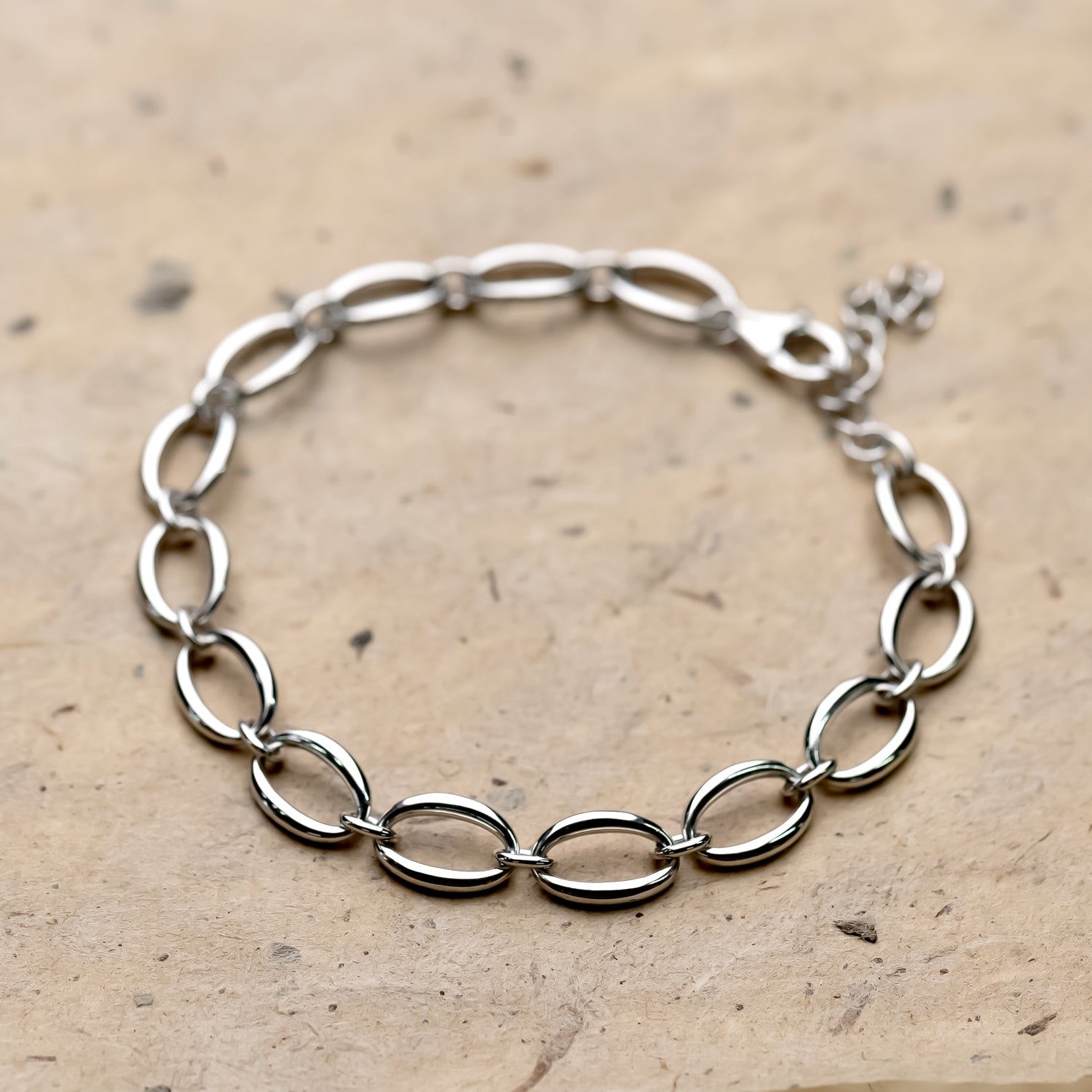 Sterling silver bracelet featuring linked open oval shapes with a polished finish, designed for a contemporary and elegant look in fine silver jewellery.