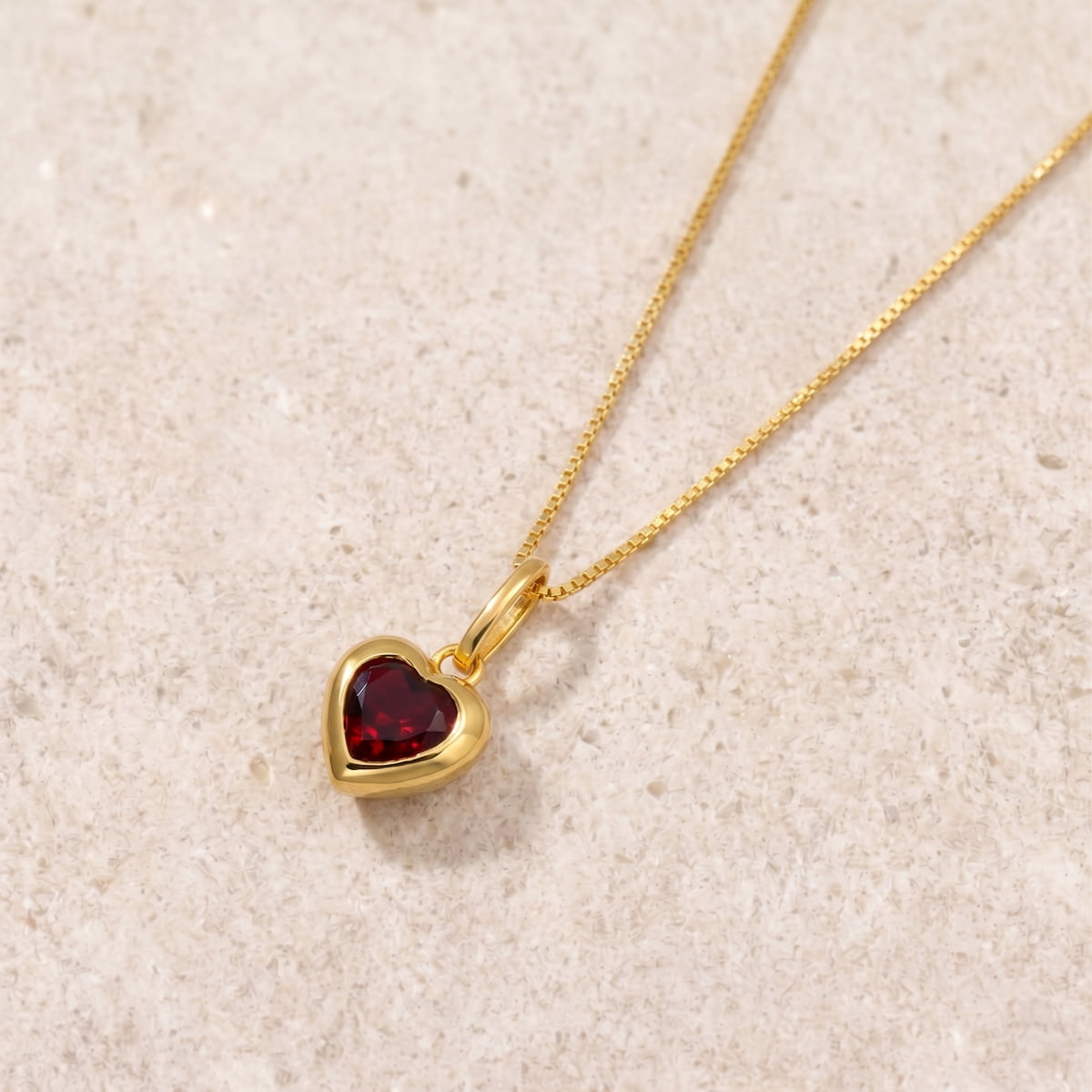 Gold vermeil pendant with a heart-shaped garnet gemstone