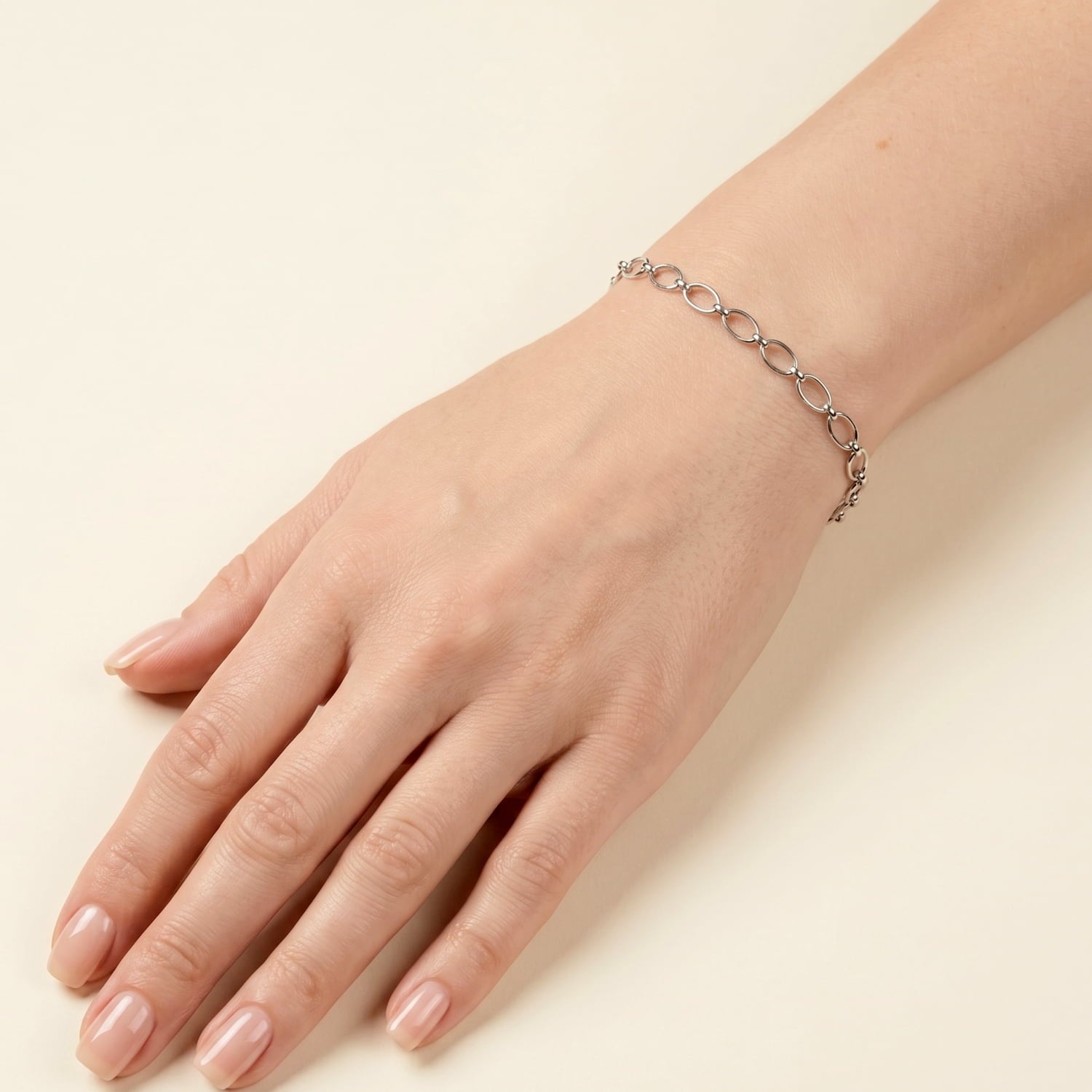 Silver oval links chain bracelet modelled on a wrist