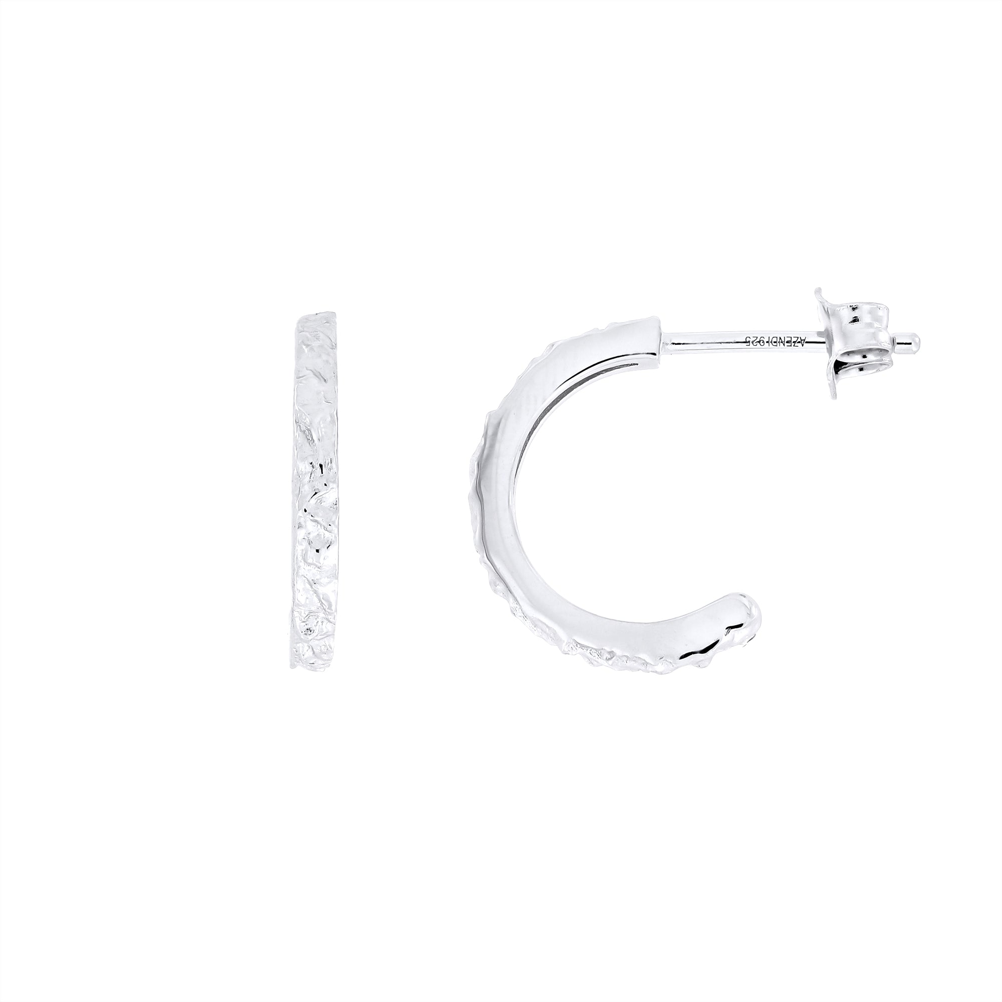 Silver textured hoop earrings on a white background